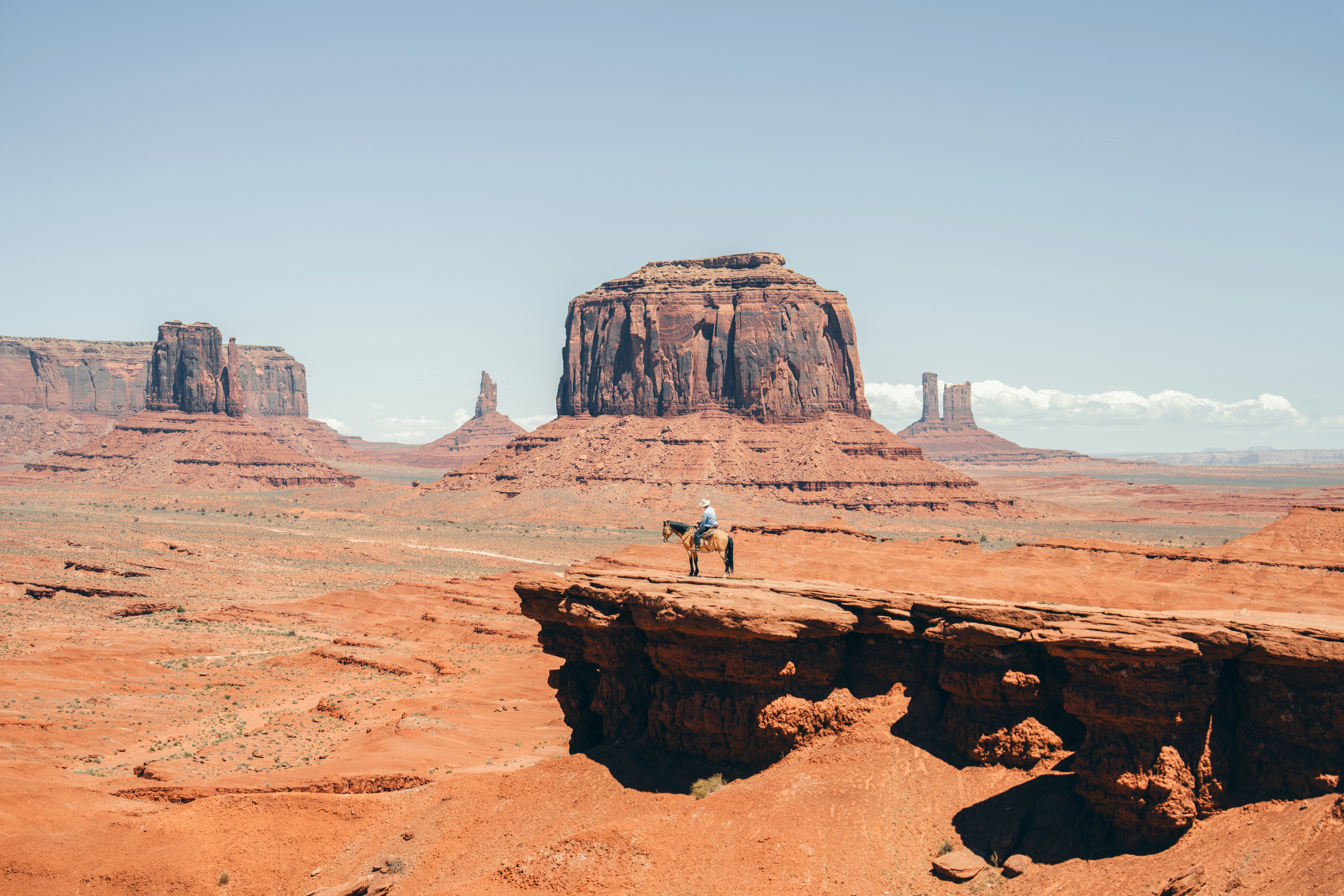 Lone Figure Stands On Cliff Edge In Monument Valley. HD mobile wallpaper