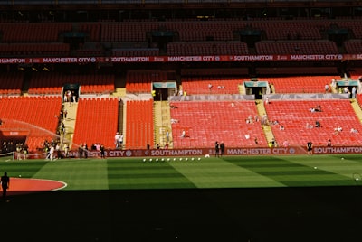 Empty Stadium Seating With A Soccer Field Below wallpaper preview