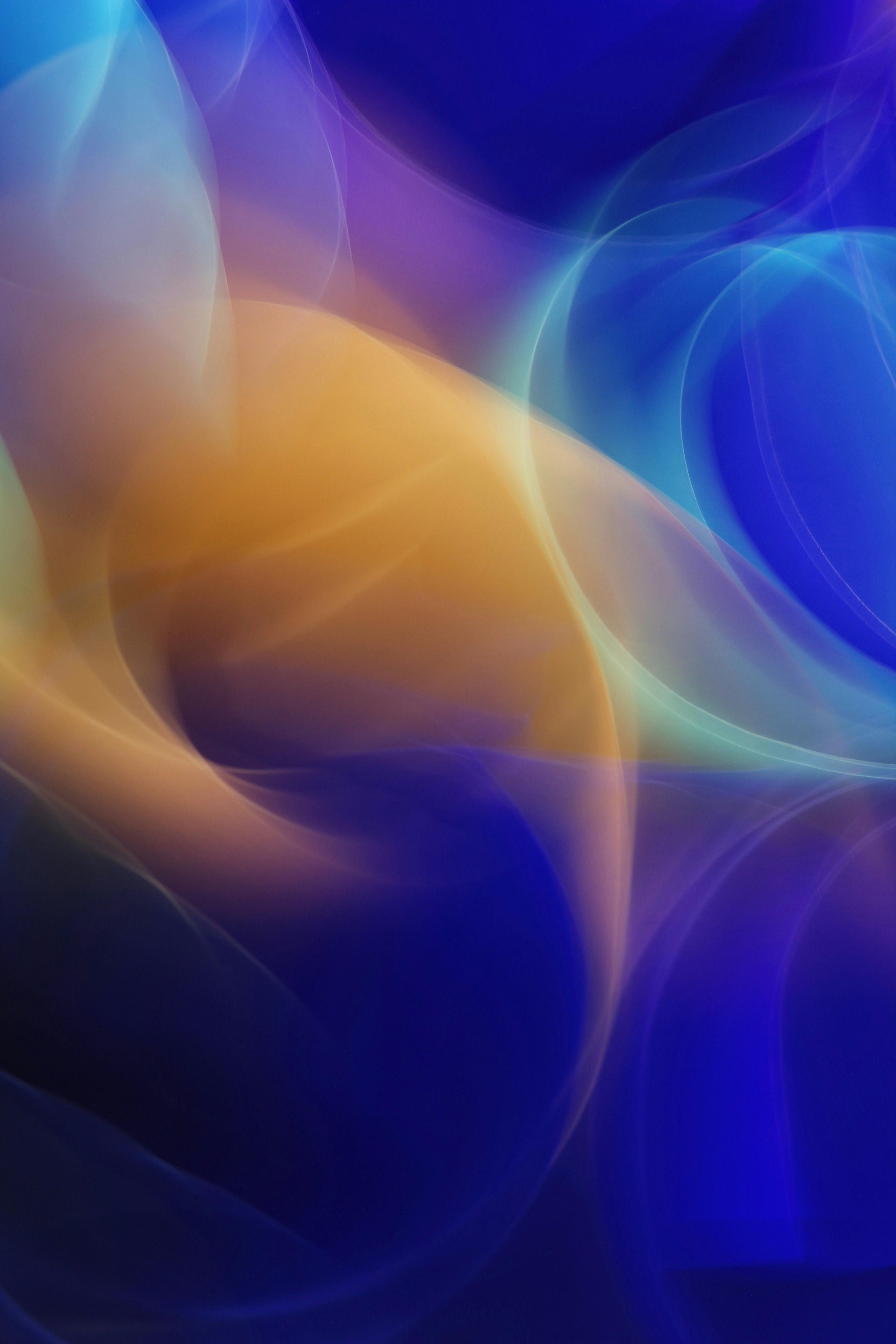 Colorful Abstract Background With Swirling Lights In Blues And Oranges. HD mobile wallpaper