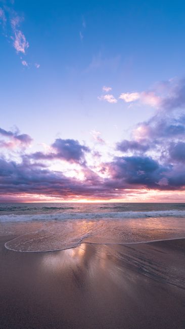 Breathtaking Sunset Over Alanya Beach With Vibrant Sky And Ocean Waves. wallpaper preview