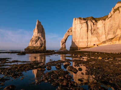 White Cliffs, A Natural Arch, And Sea Stack At Sunset. wallpaper preview