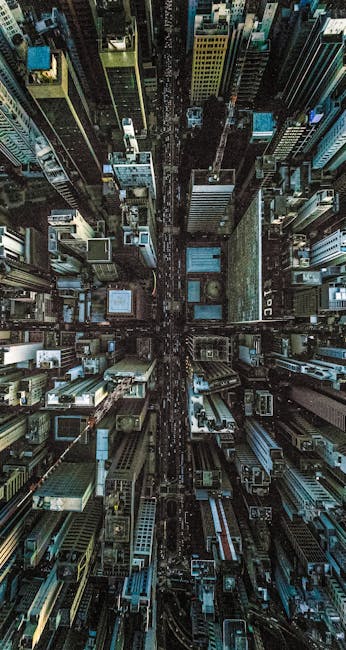 A Breathtaking Aerial Perspective Of A Dense Urban Cityscape Showcasing Towering Skyscrapers And Bustling Streets. wallpaper preview