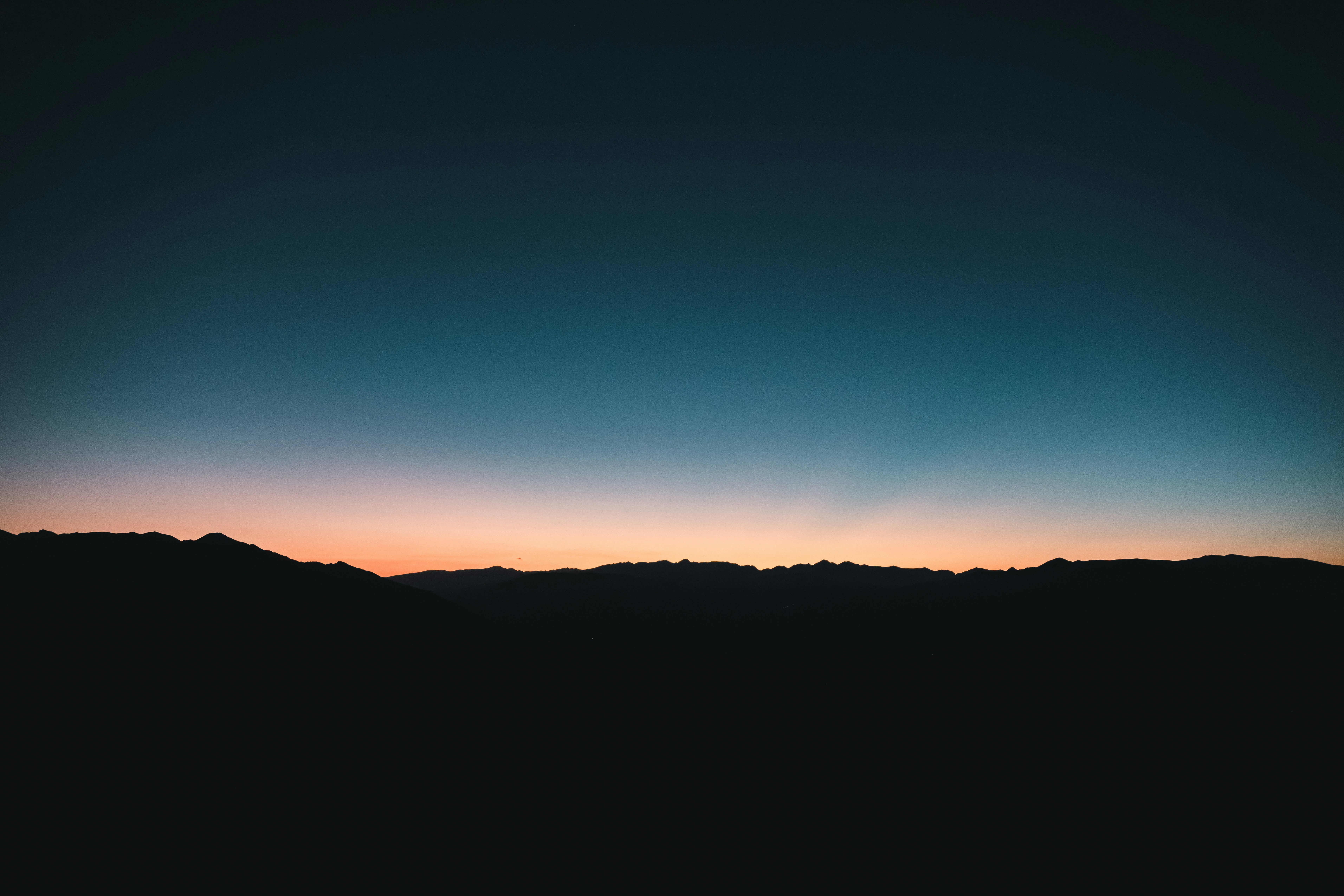 Dark Mountain Silhouettes Against A Colorful Twilight Sky. HD mobile wallpaper