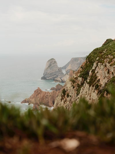 Dramatic Coastal Cliffs Overlooking A Vast, Calm Ocean. wallpaper preview