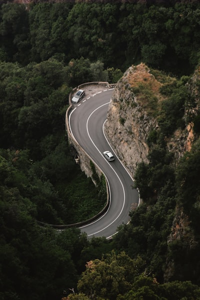 Cars Navigating A Curvy Amalfi Coast Road wallpaper preview