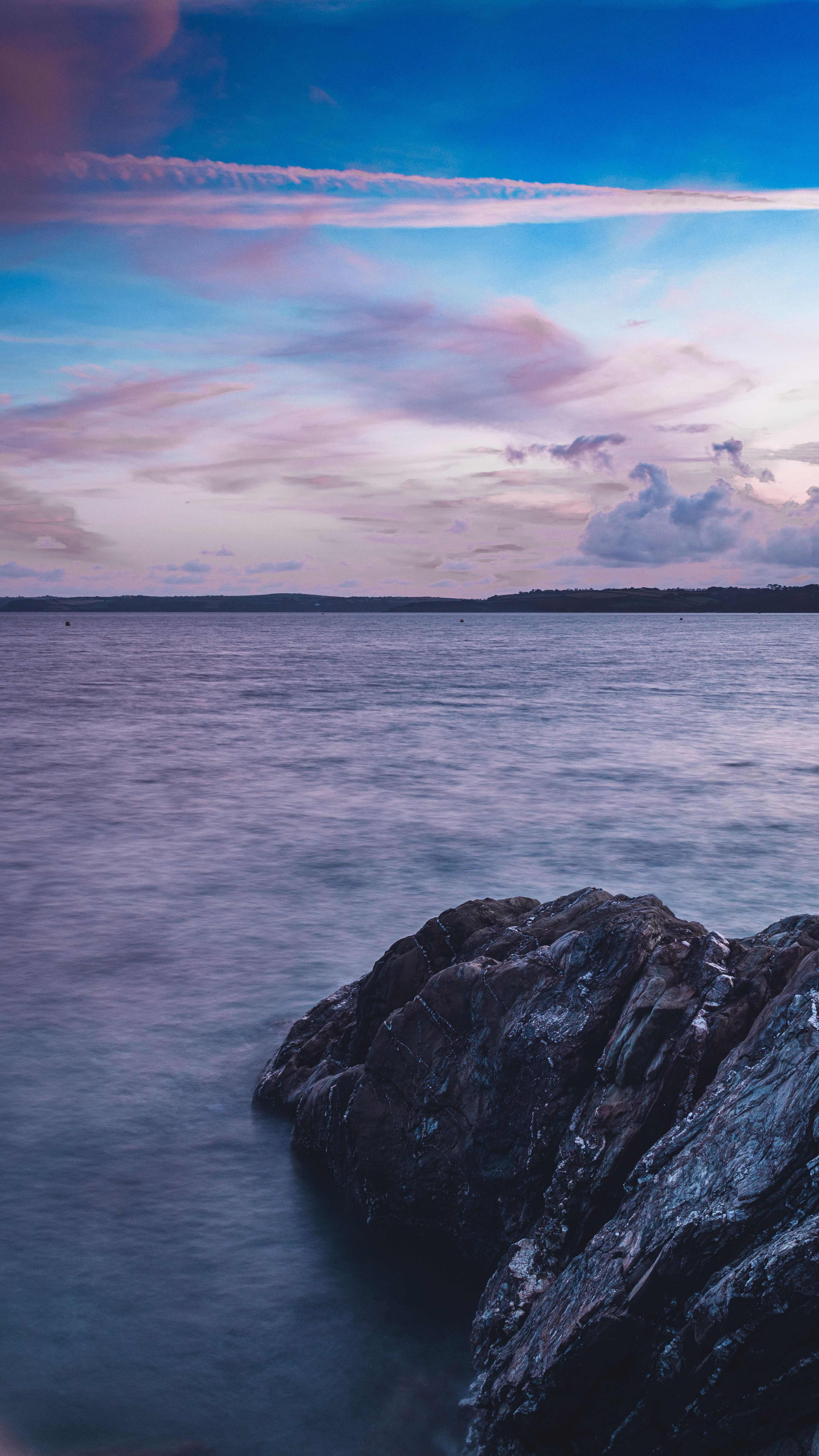 Serene Ocean And Rocky Shore At Dusk In Falmouth, England, With A Colorful Sky. HD mobile wallpaper