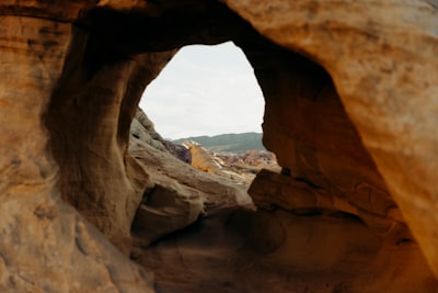 View Through A Rock Arch At A Desert Landscape wallpaper preview
