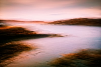 A Quiet Highland Loch Under An Overcast Sky, Where Soft Light Settles Across Water And Bracken-covered Shores. Captured Using Intentional Camera Movement, Transforming A Fleeting Moment Of Stillness Into An Atmospheric Impression Of The Scottish Landscape. wallpaper preview