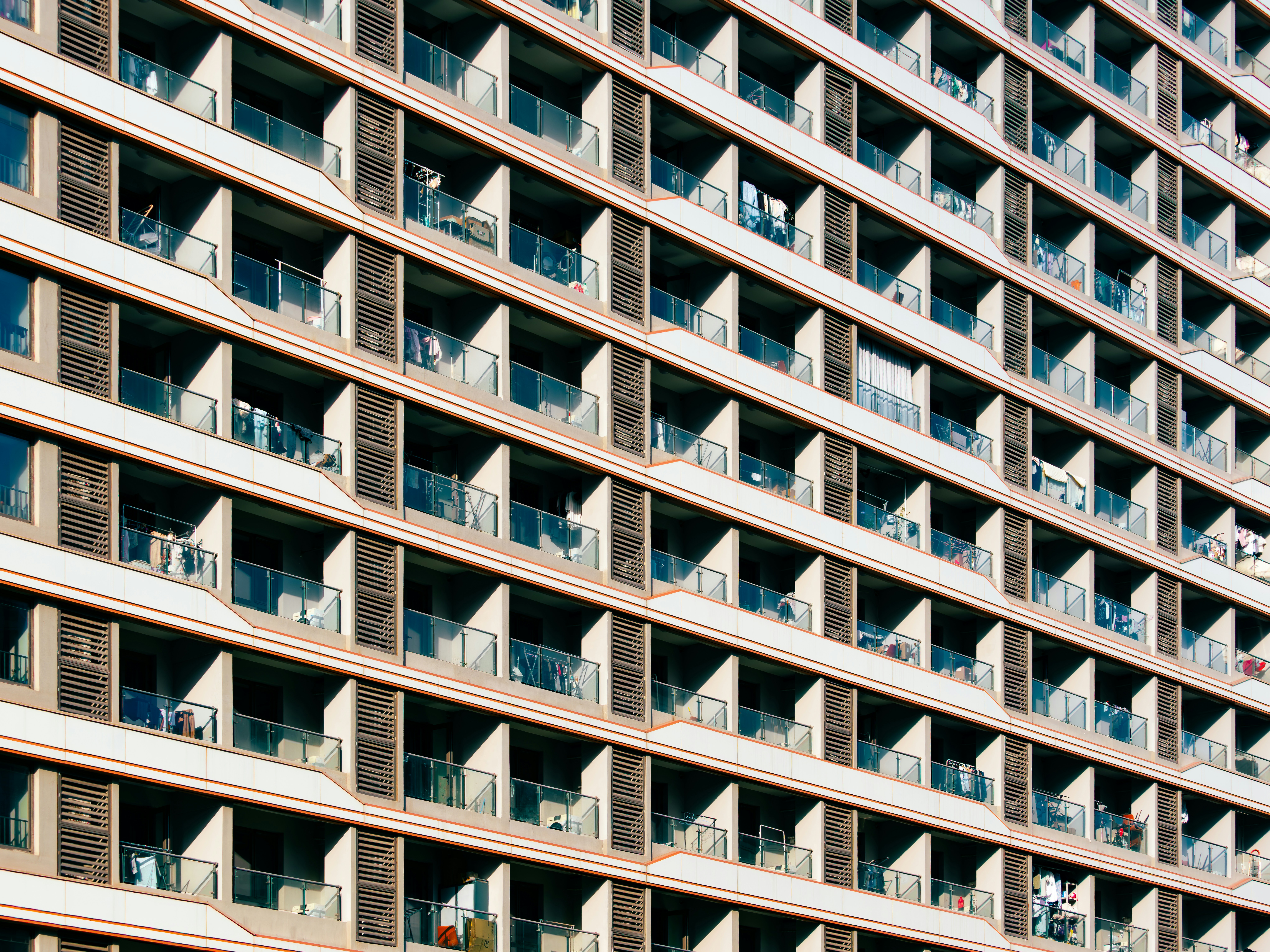 Modern Building Facade With Numerous Windows And Balconies. HD mobile wallpaper