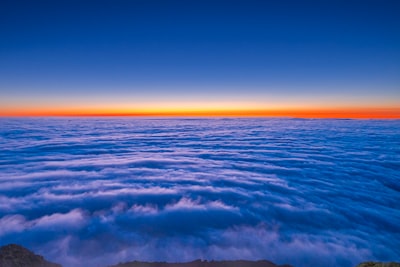 Vibrant Sunset Over A Vast Sea Of Clouds. wallpaper preview
