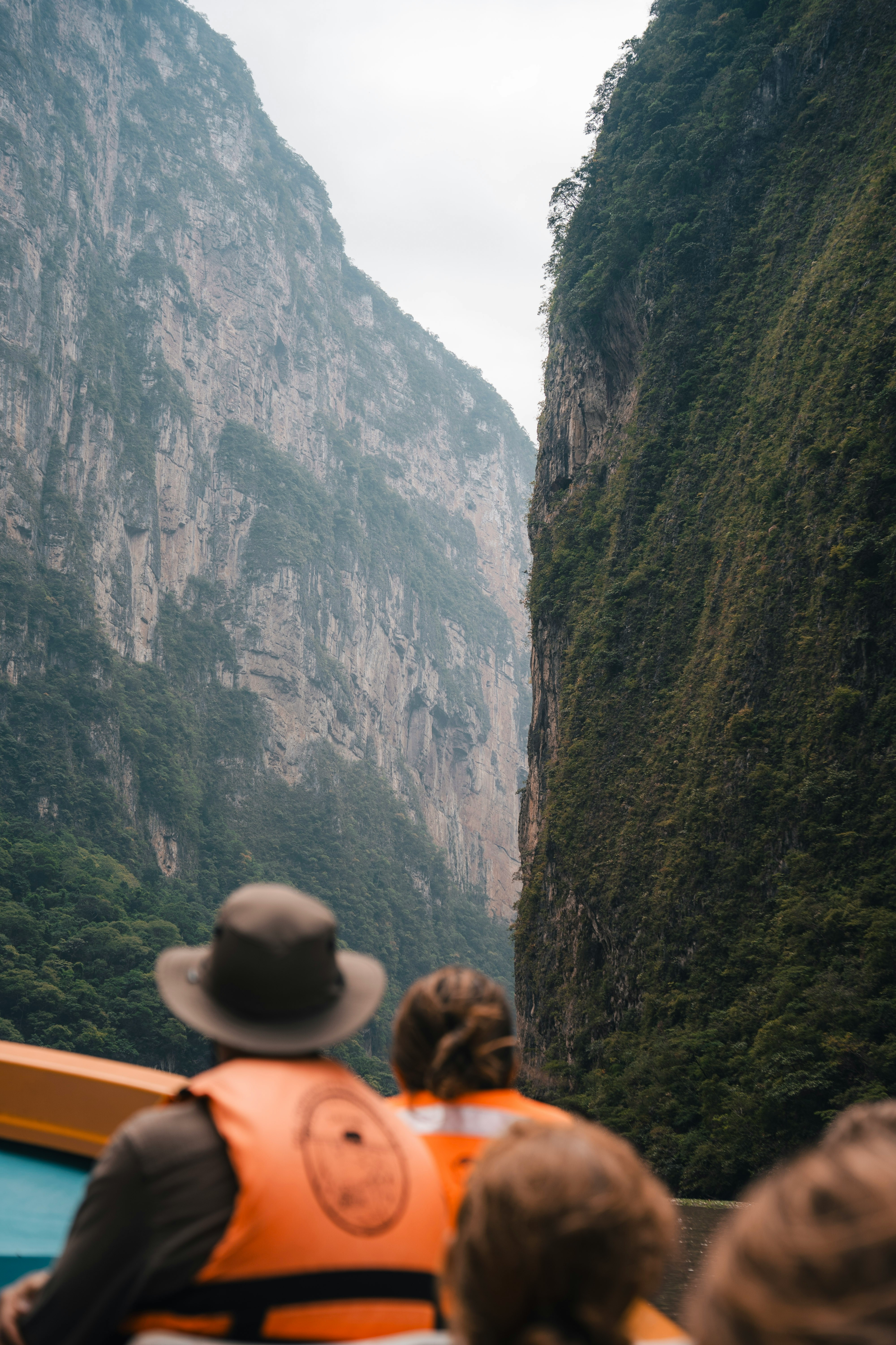 People In Life Vests On A Boat In A Canyon. HD mobile wallpaper