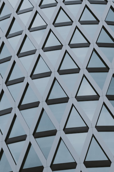 Geometric Pattern Of Triangular Windows On A Building wallpaper preview