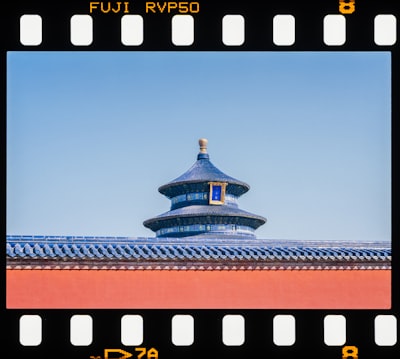 Traditional Chinese Temple Roof And Red Wall Under Clear Sky. wallpaper preview