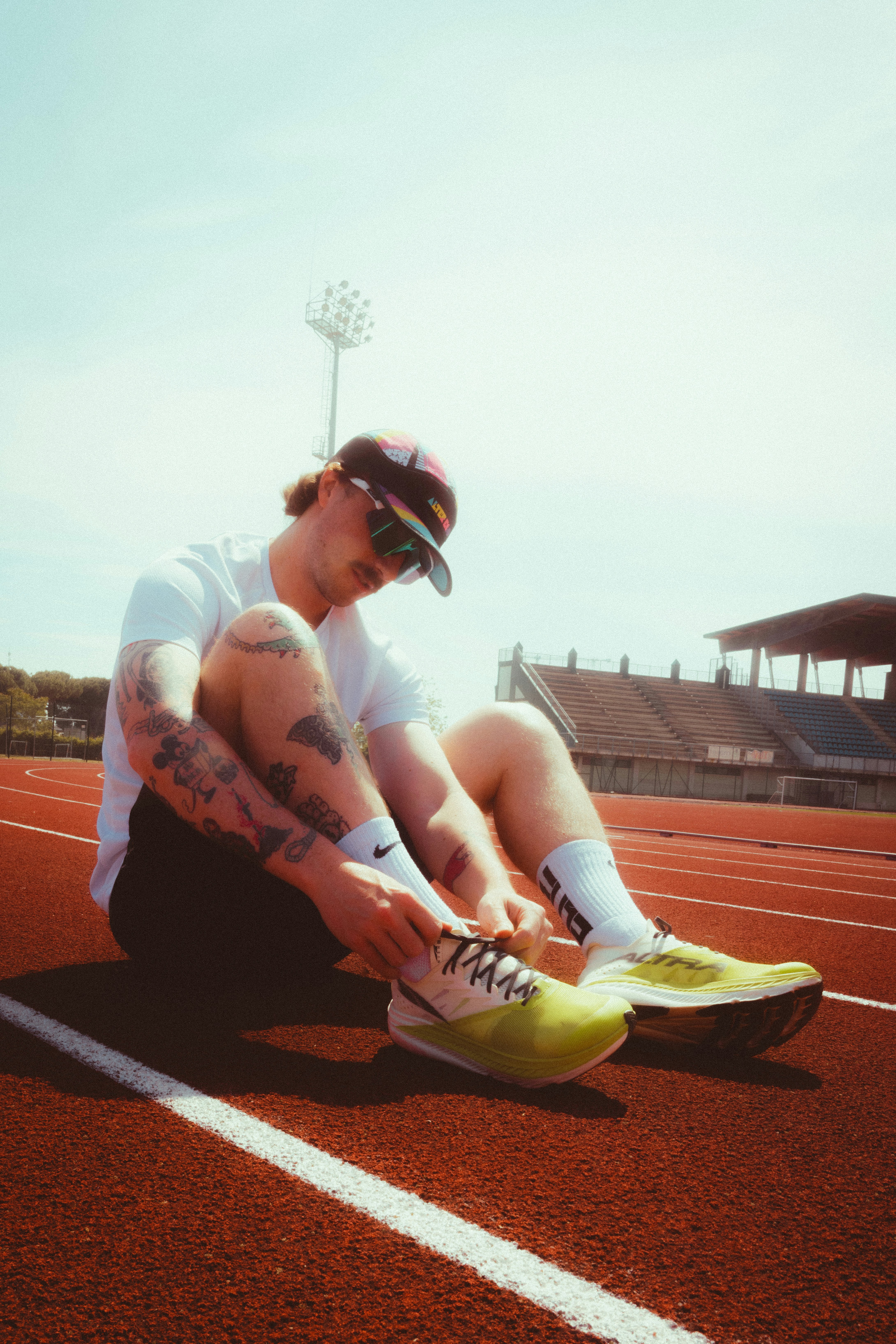 Tattooed Legs, Neon Kicks, Blurred Stride; That's Real Track Day Energy. HD mobile wallpaper