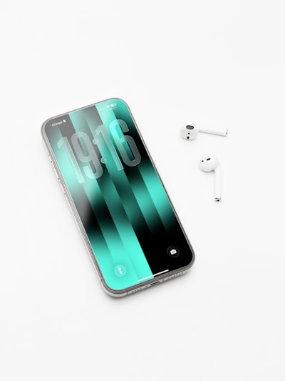 Iphone 17 Pro Max With AirPods On White Desk. wallpaper preview
