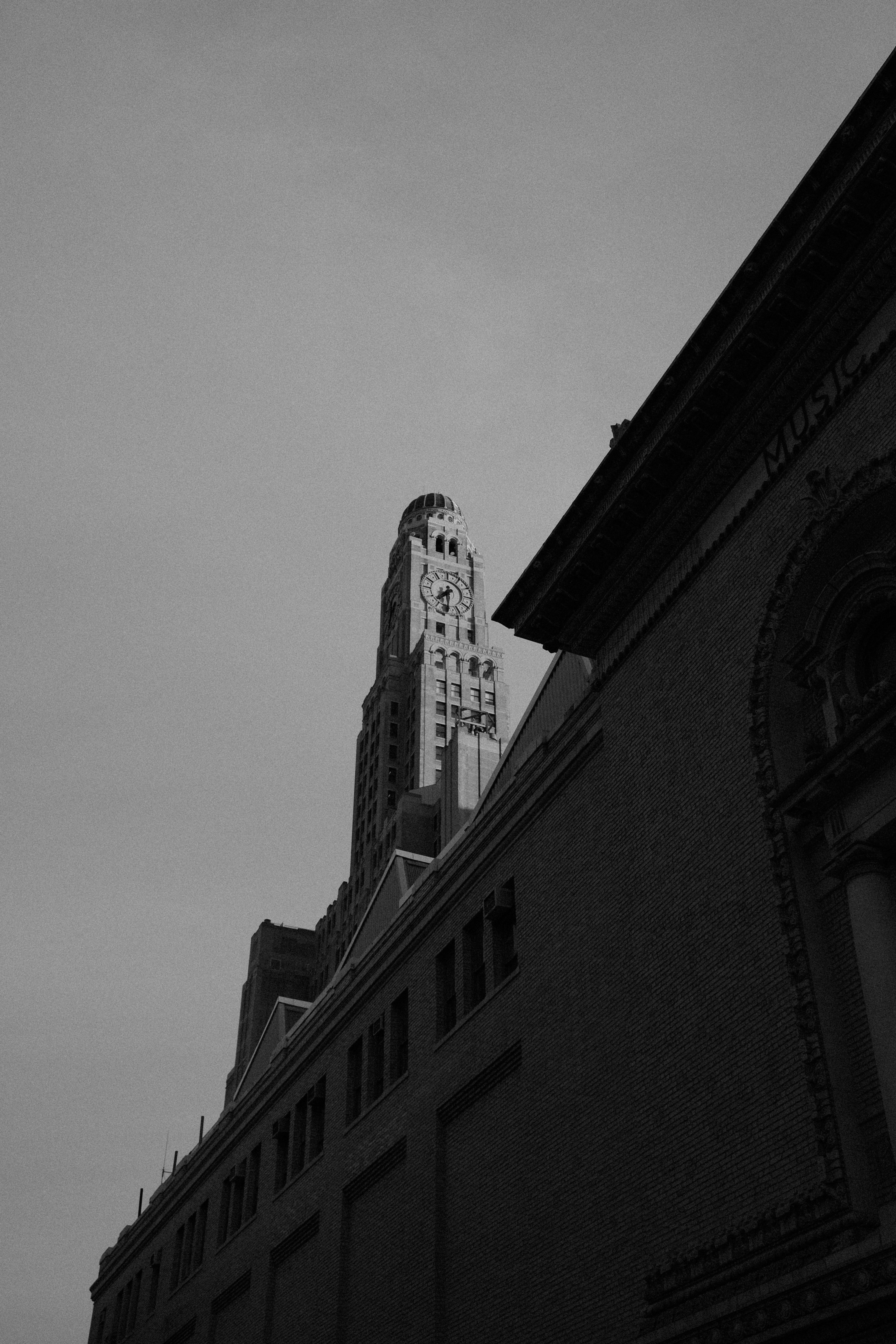 Ornate Skyscraper Towering Over A Dark Urban Building. HD mobile wallpaper