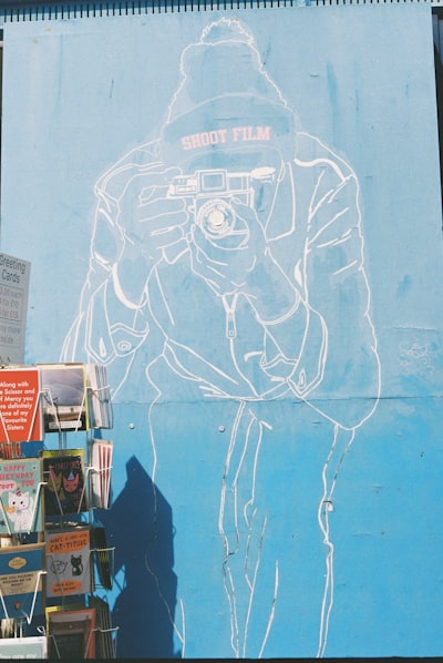 Mural Of Person Holding Camera, wallpaper preview