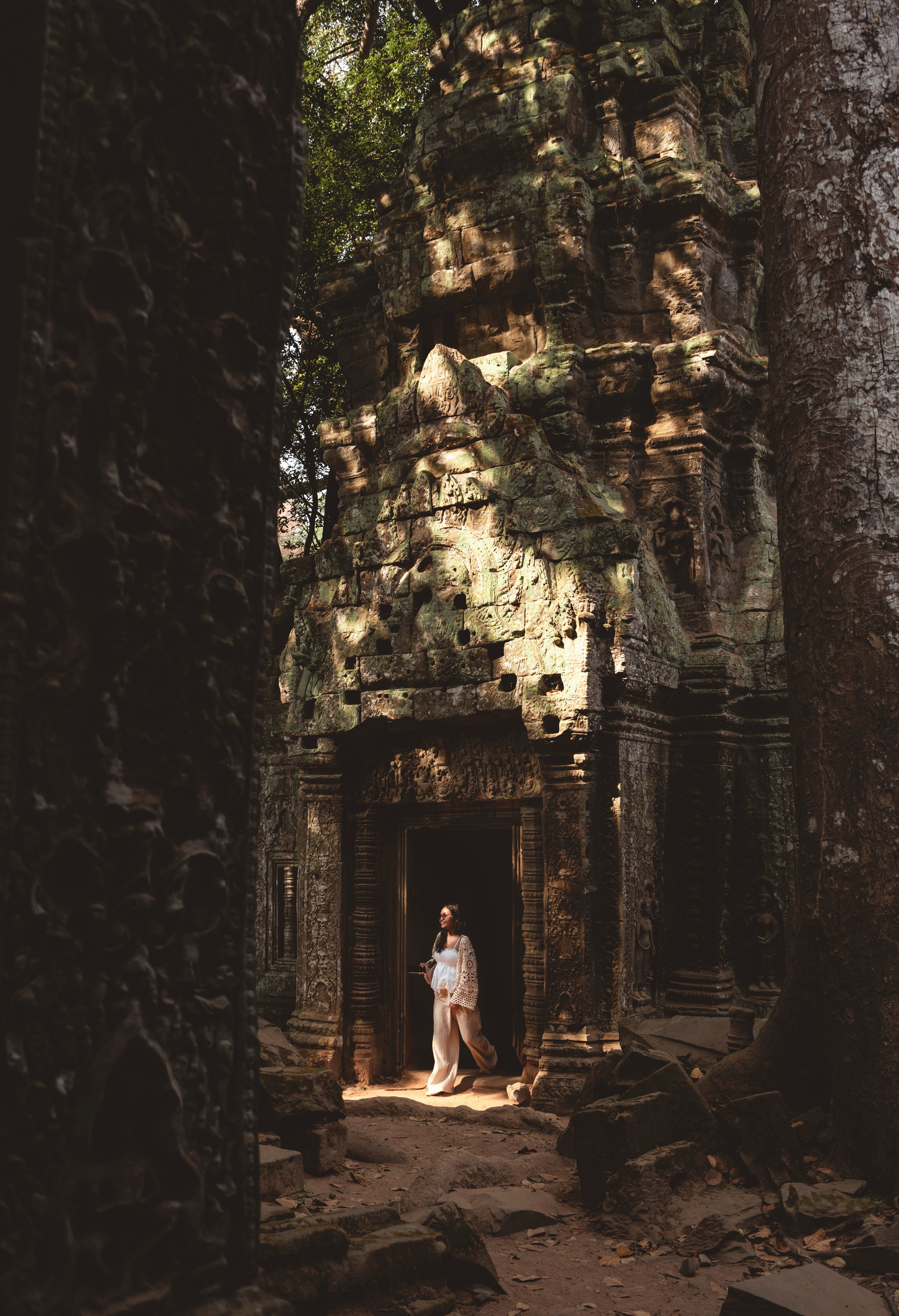 Woman Walking From Ancient Temple Entrance Framed By Trees. HD mobile wallpaper