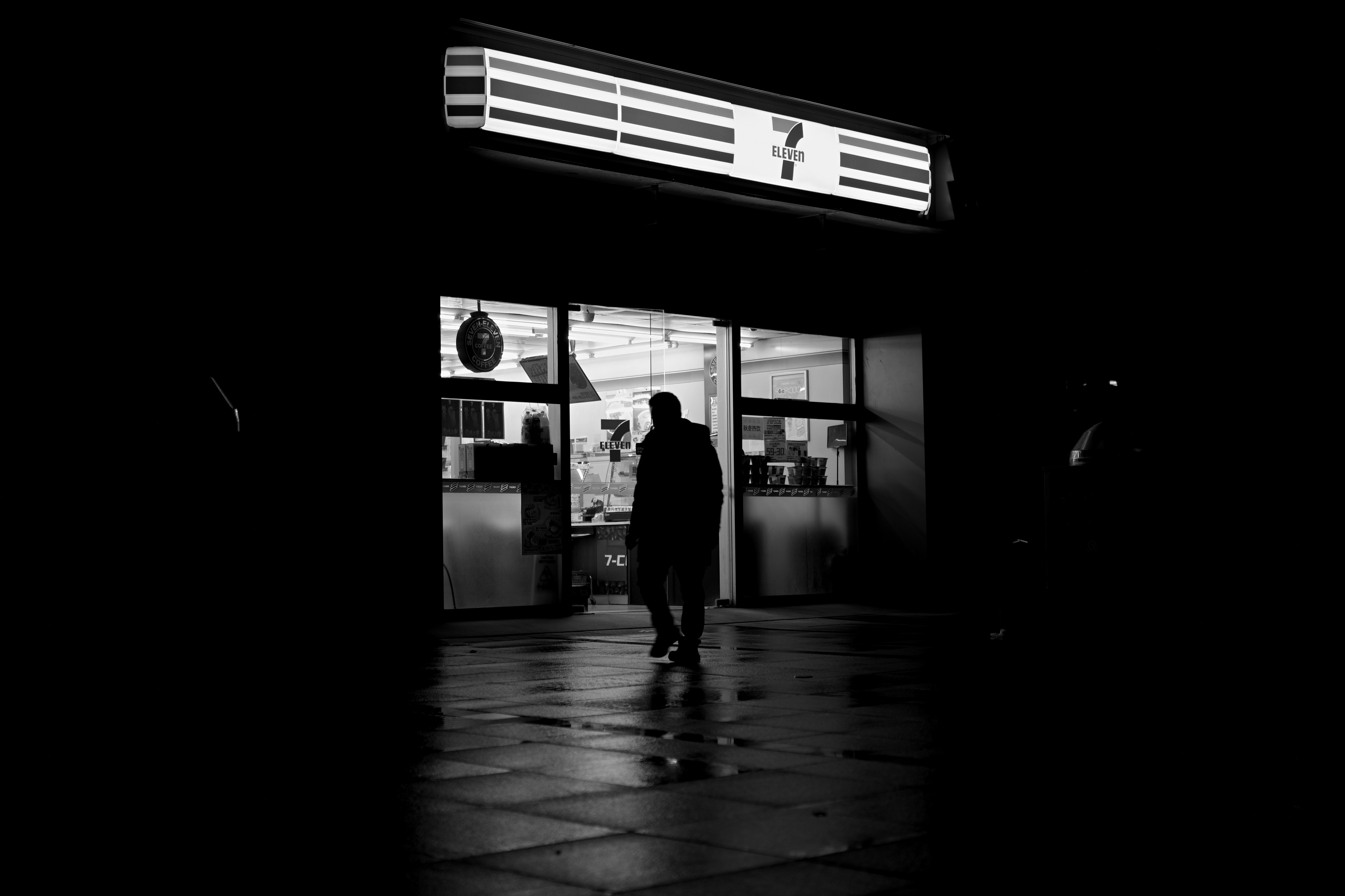 Man Walks Into A Brightly Lit Store At Night HD mobile wallpaper