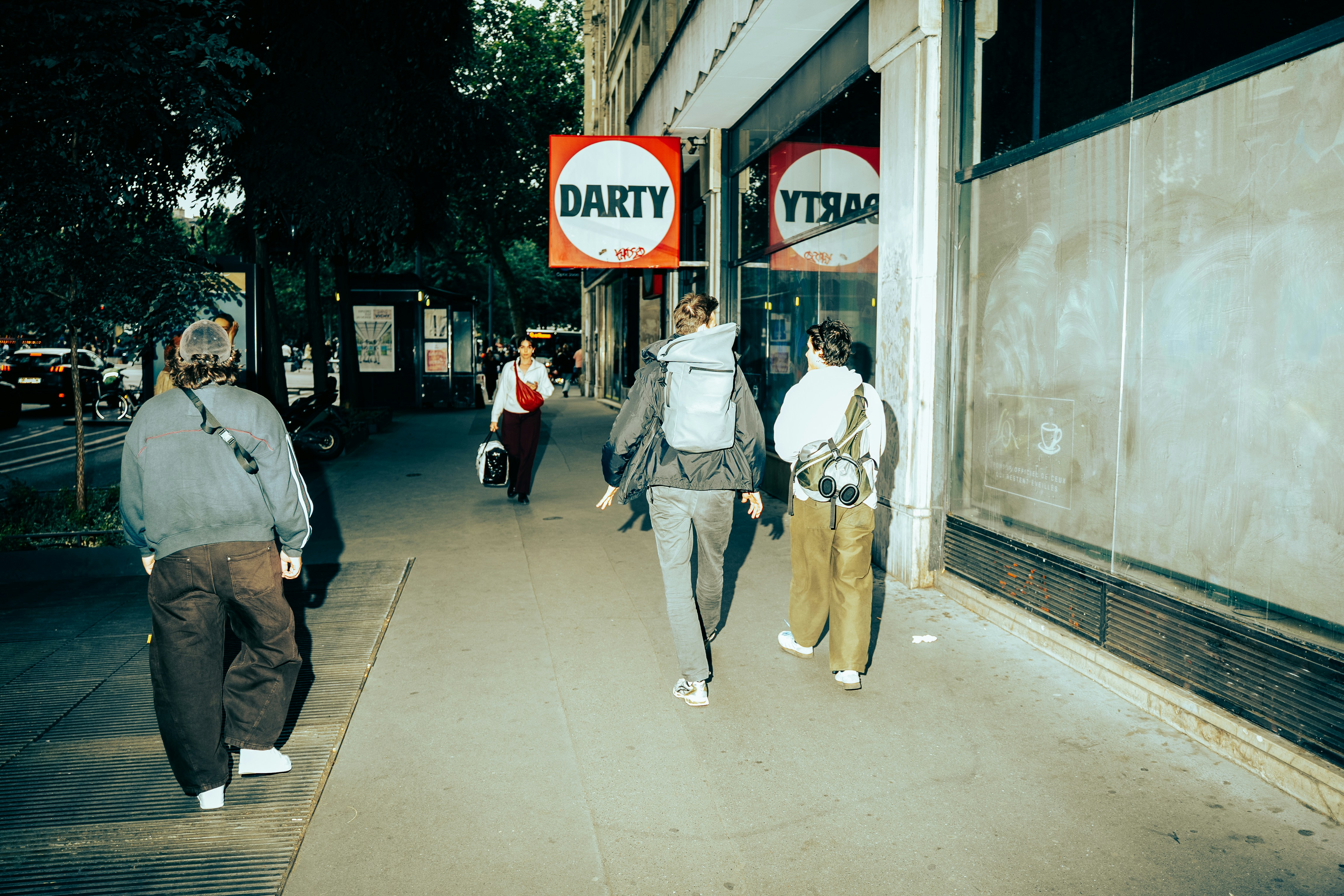 People Walk Past A Darty Store On A City Street. HD mobile wallpaper