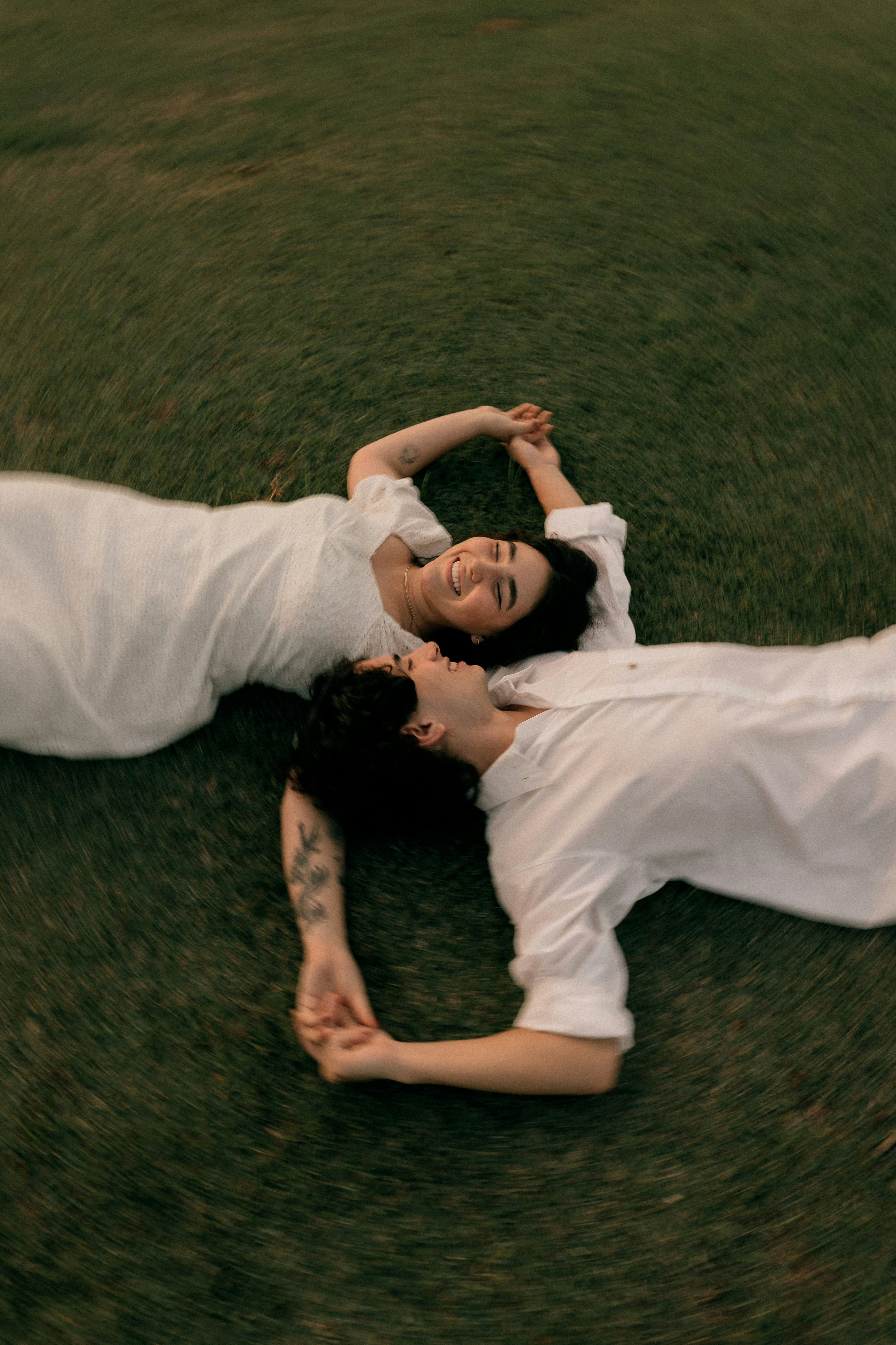 Two Happy People In White Lying On Green Grass. HD mobile wallpaper