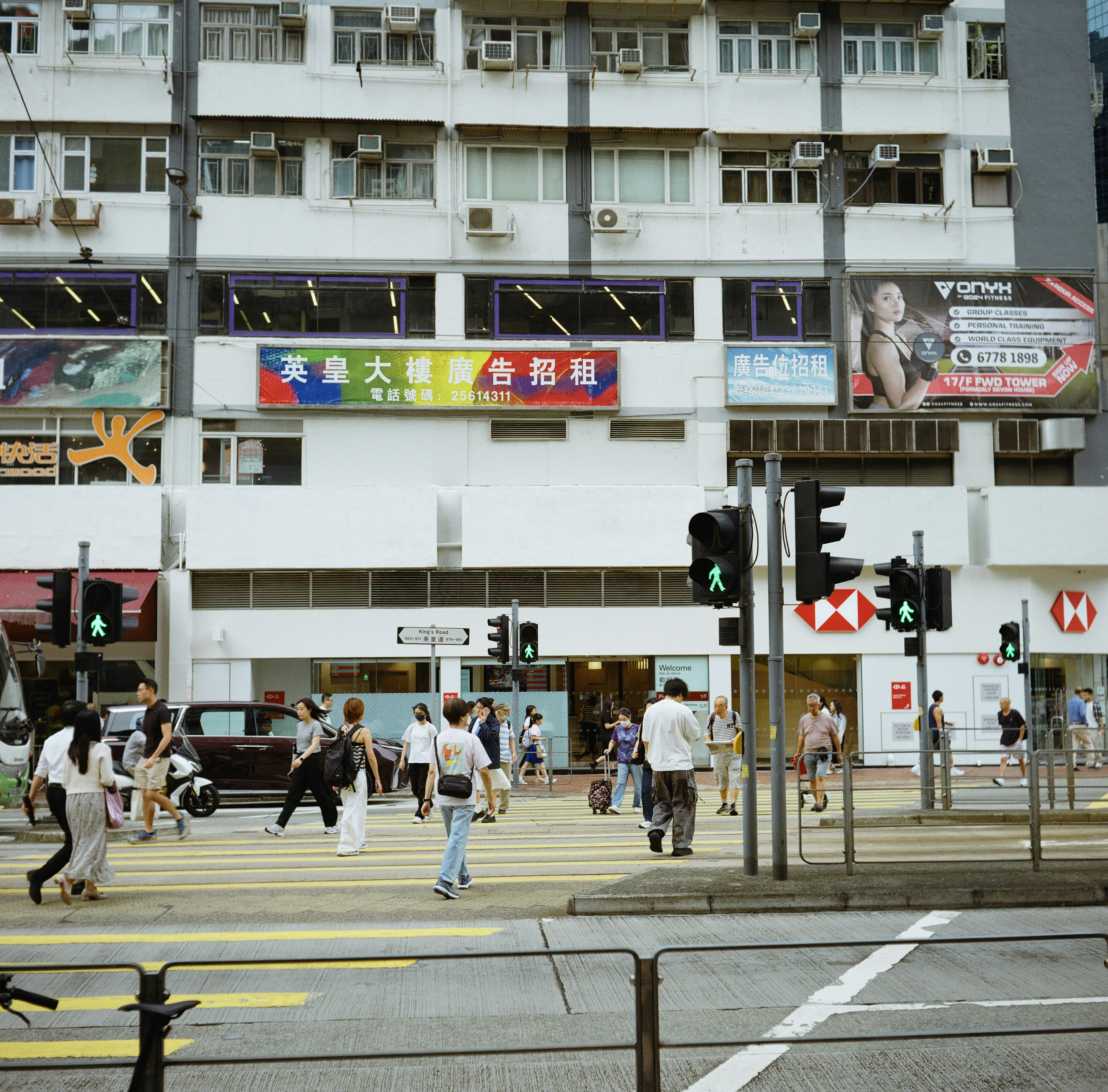 Pedestrians Crossing A Busy Street In Front Of Urban Buildings. HD mobile wallpaper