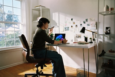 Person Working At Desk With Laptop And Phone. wallpaper preview