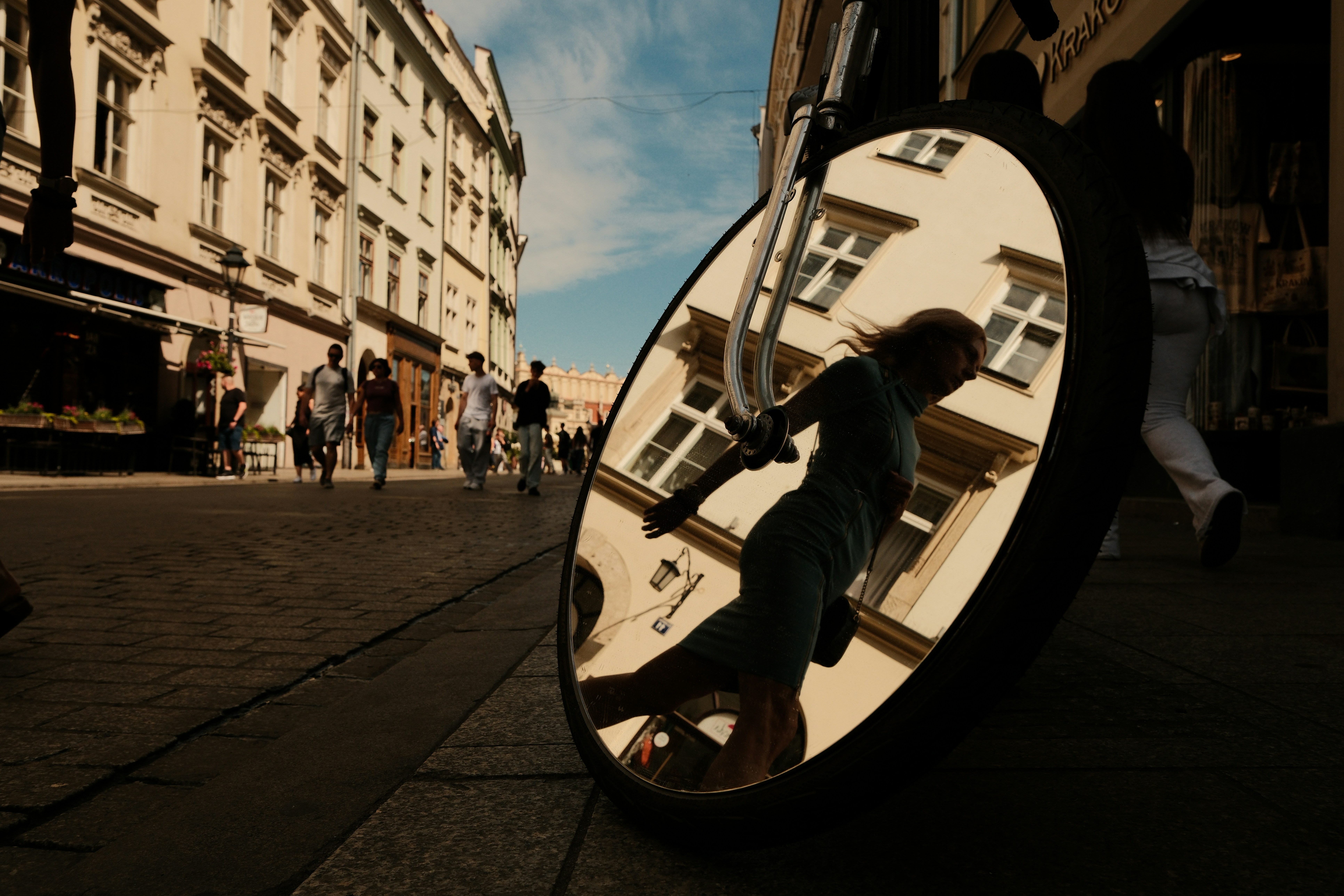 Round Mirror Reflecting A Person On A Historic City Street. HD mobile wallpaper