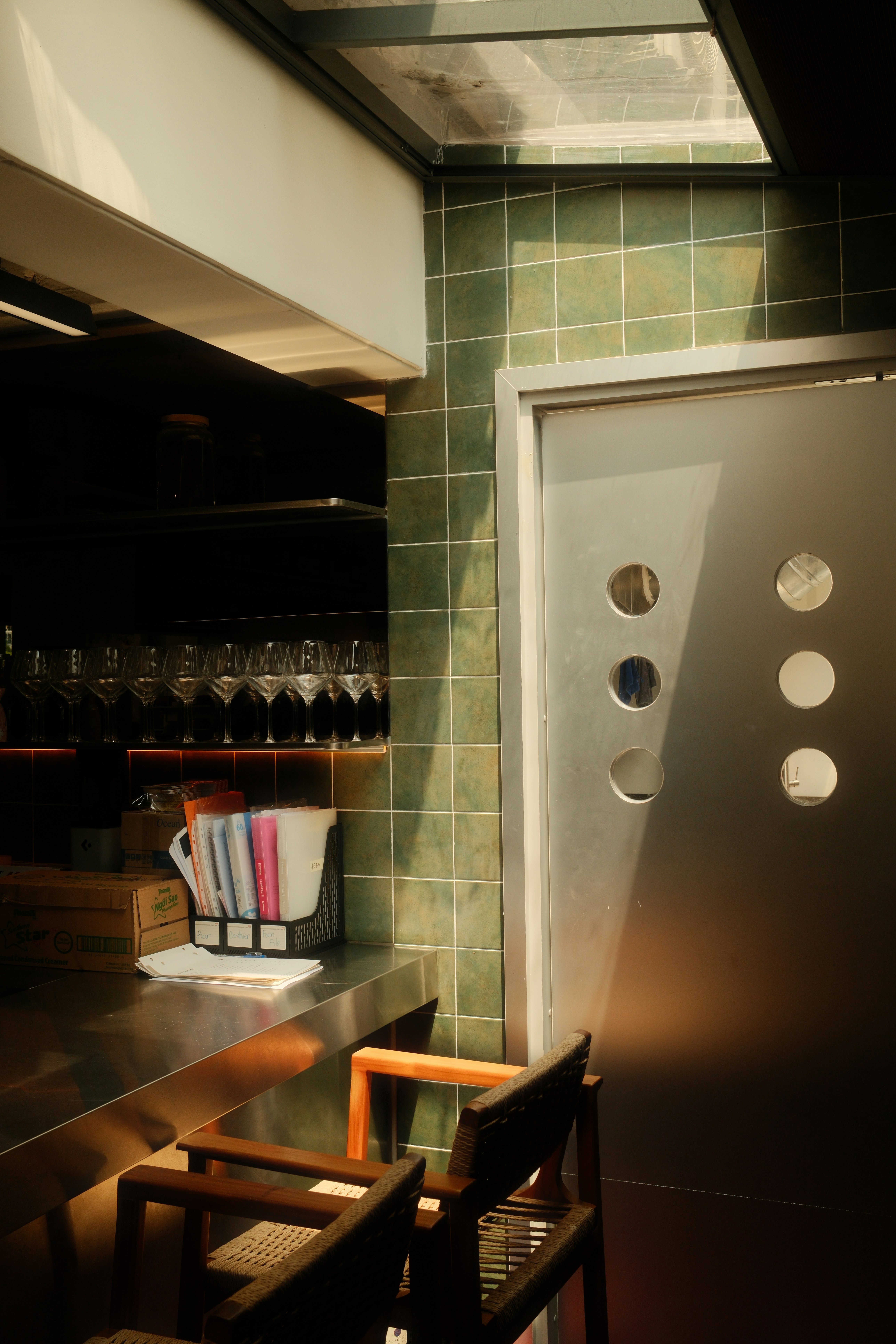Sunlit Modern Bar With Green Tiled Wall And Metal Door. HD mobile wallpaper