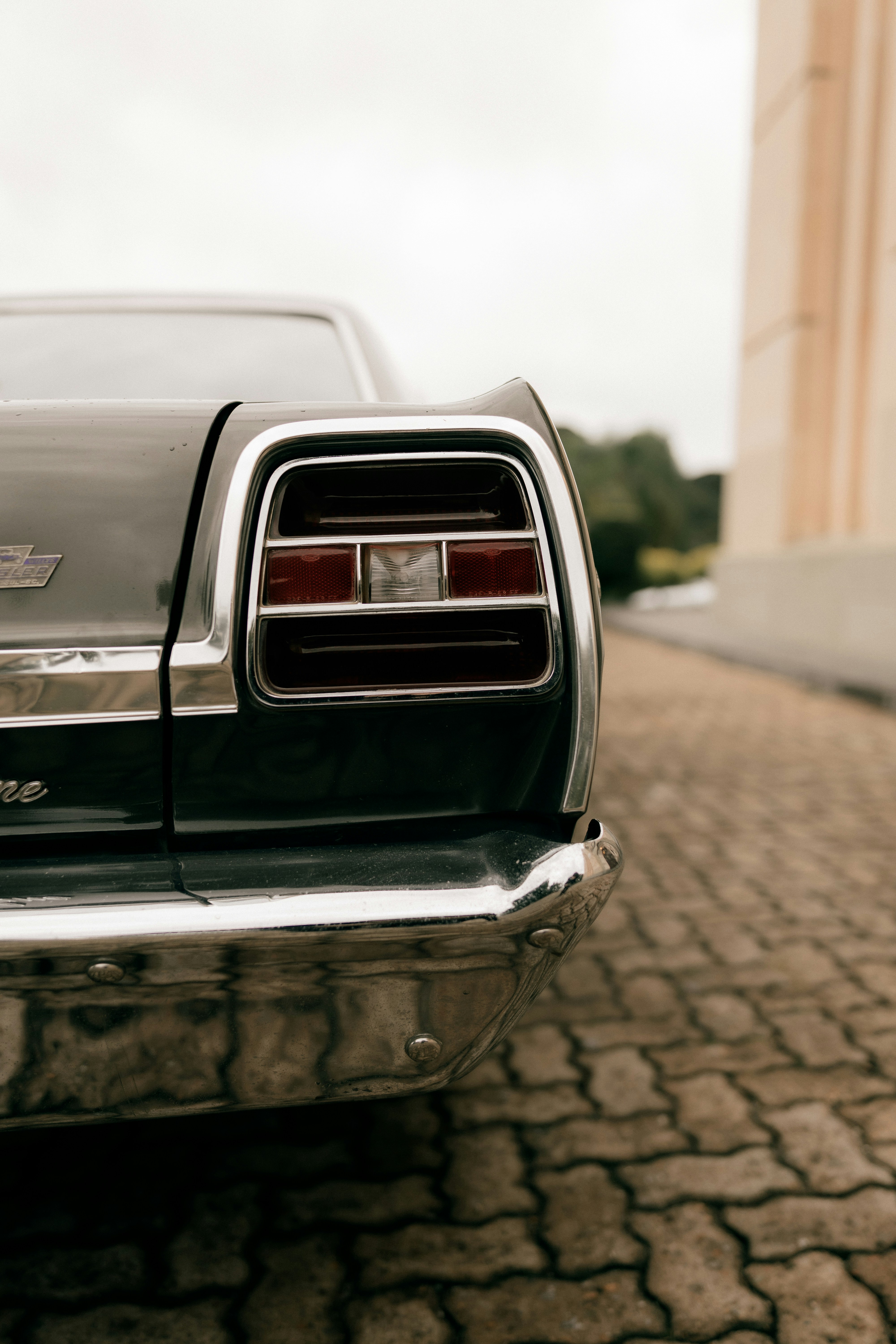 Close-up Of A Vintage Car's Taillight And Bumper. HD mobile wallpaper