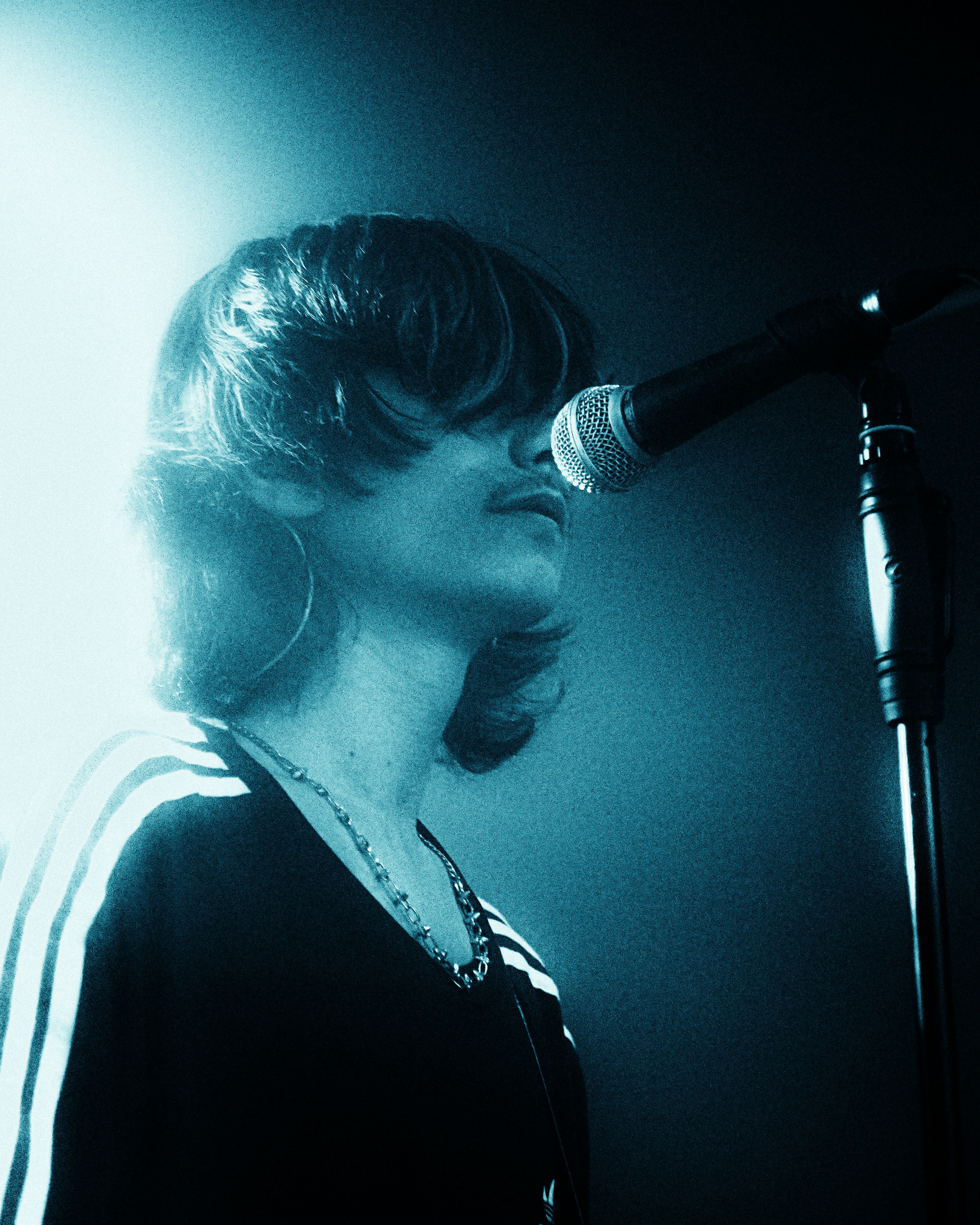Performer With Long Hair And Mustache Sings Into A Microphone. HD mobile wallpaper