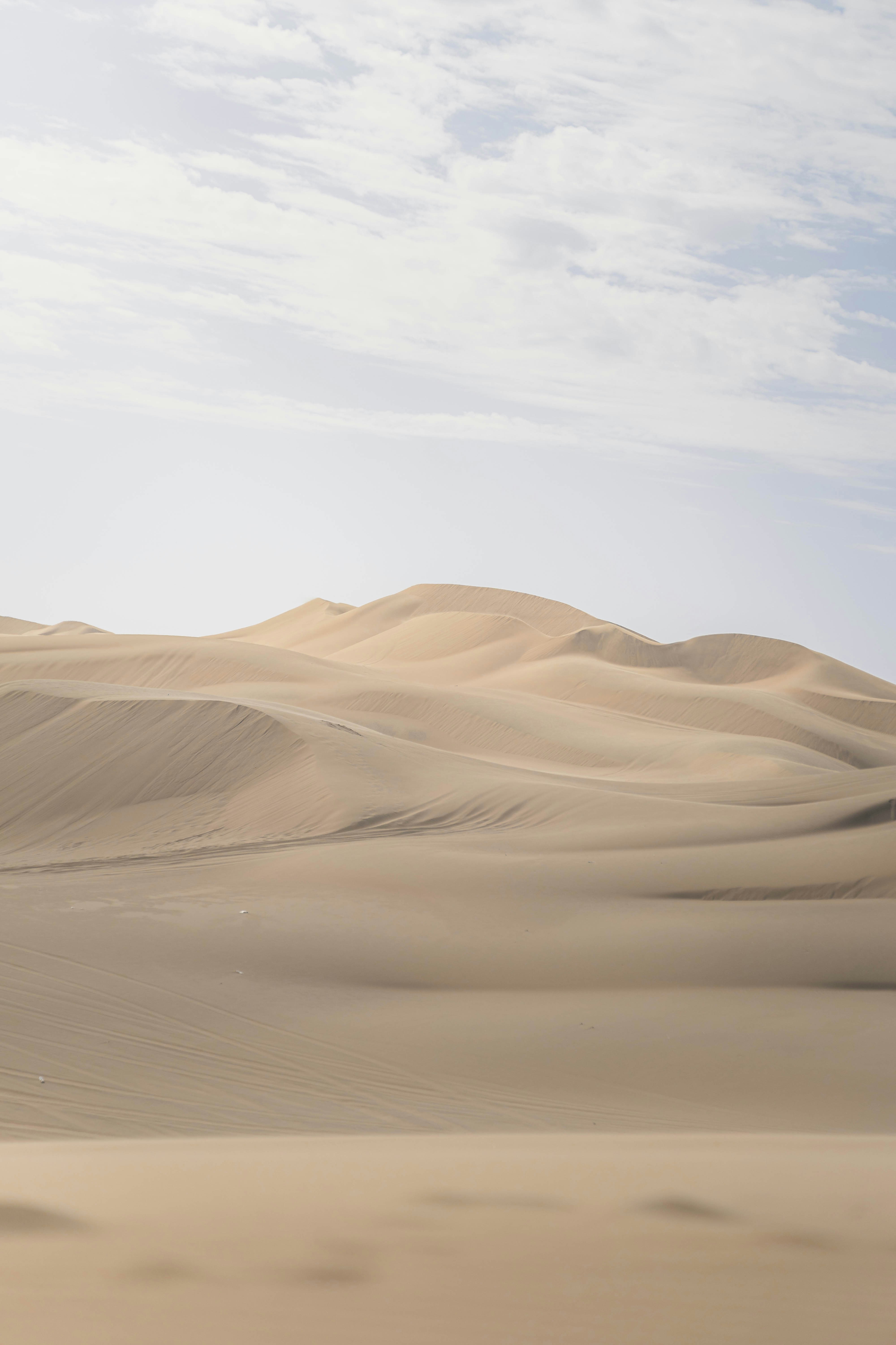 Rolling Sand Dunes Under A Cloudy Sky HD mobile wallpaper