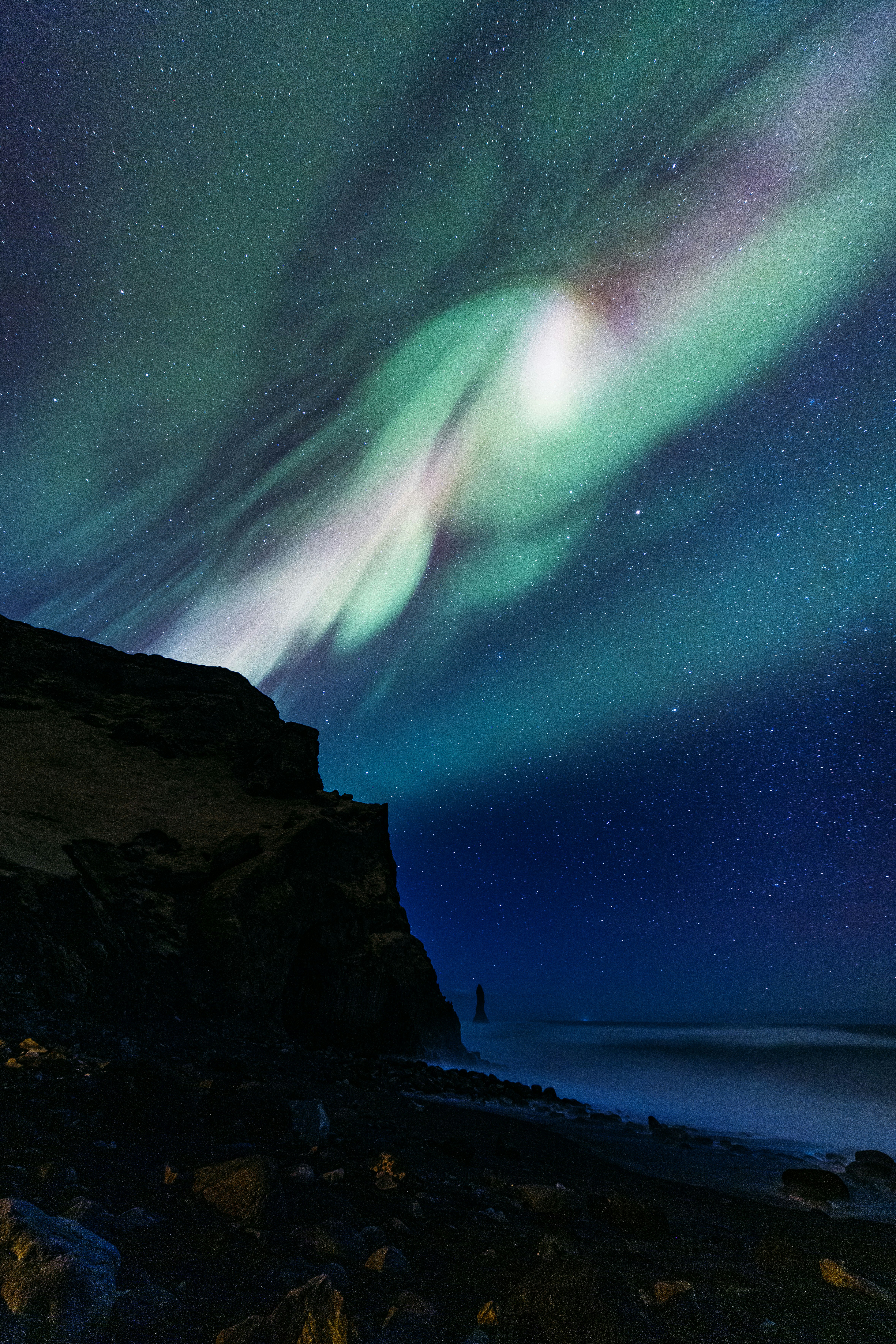 Aurora Borealis Illuminates Dark Night Sky Over Ocean And Cliffs. HD mobile wallpaper