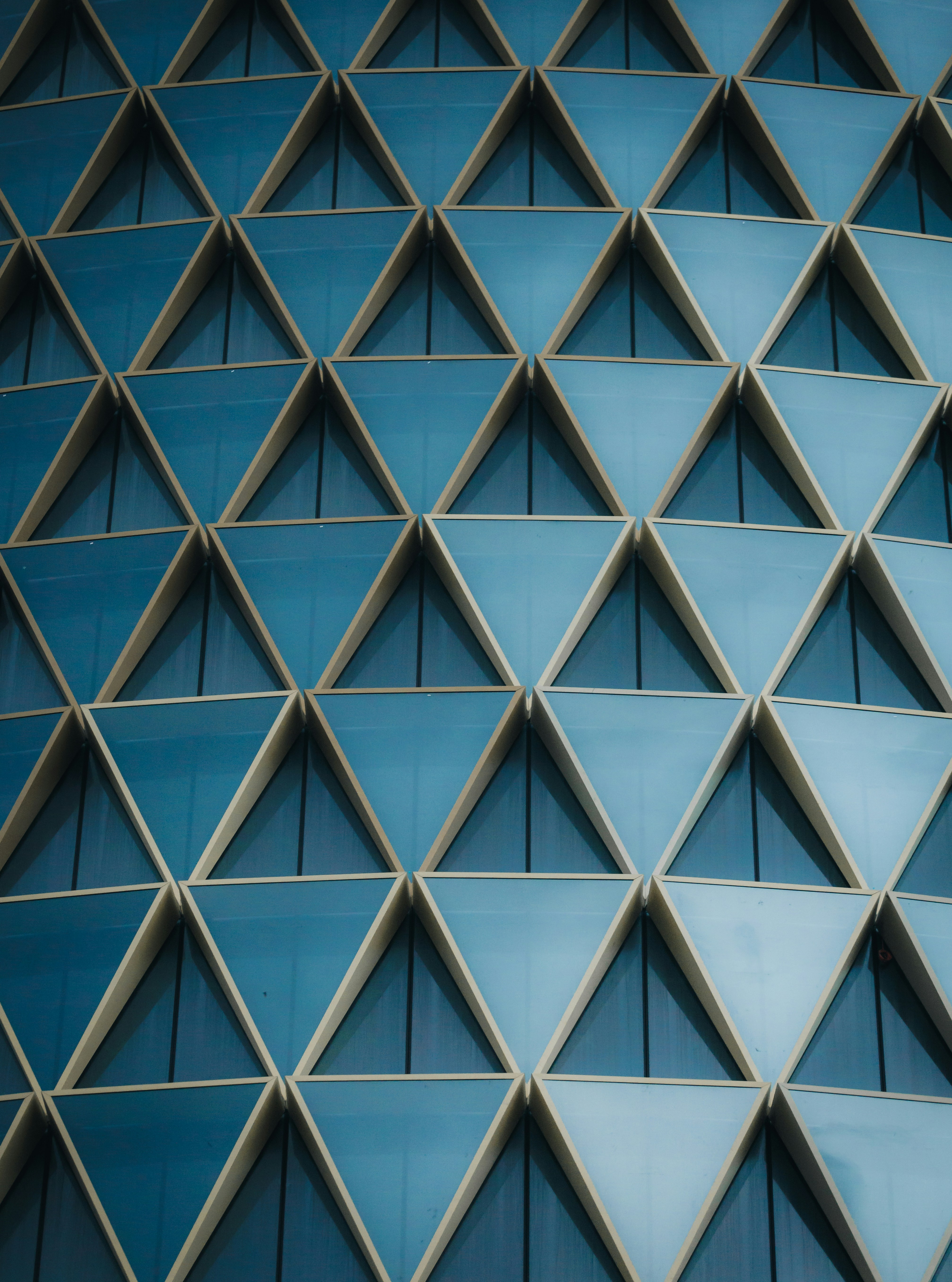Geometric Blue Triangular Windows On A Modern Building Facade. HD mobile wallpaper