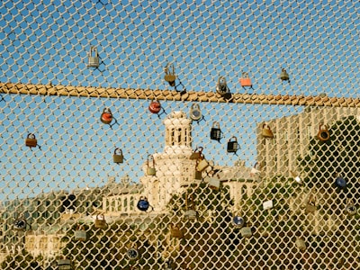 Colorful Locks On A Metal Grid Along The Bridge wallpaper preview