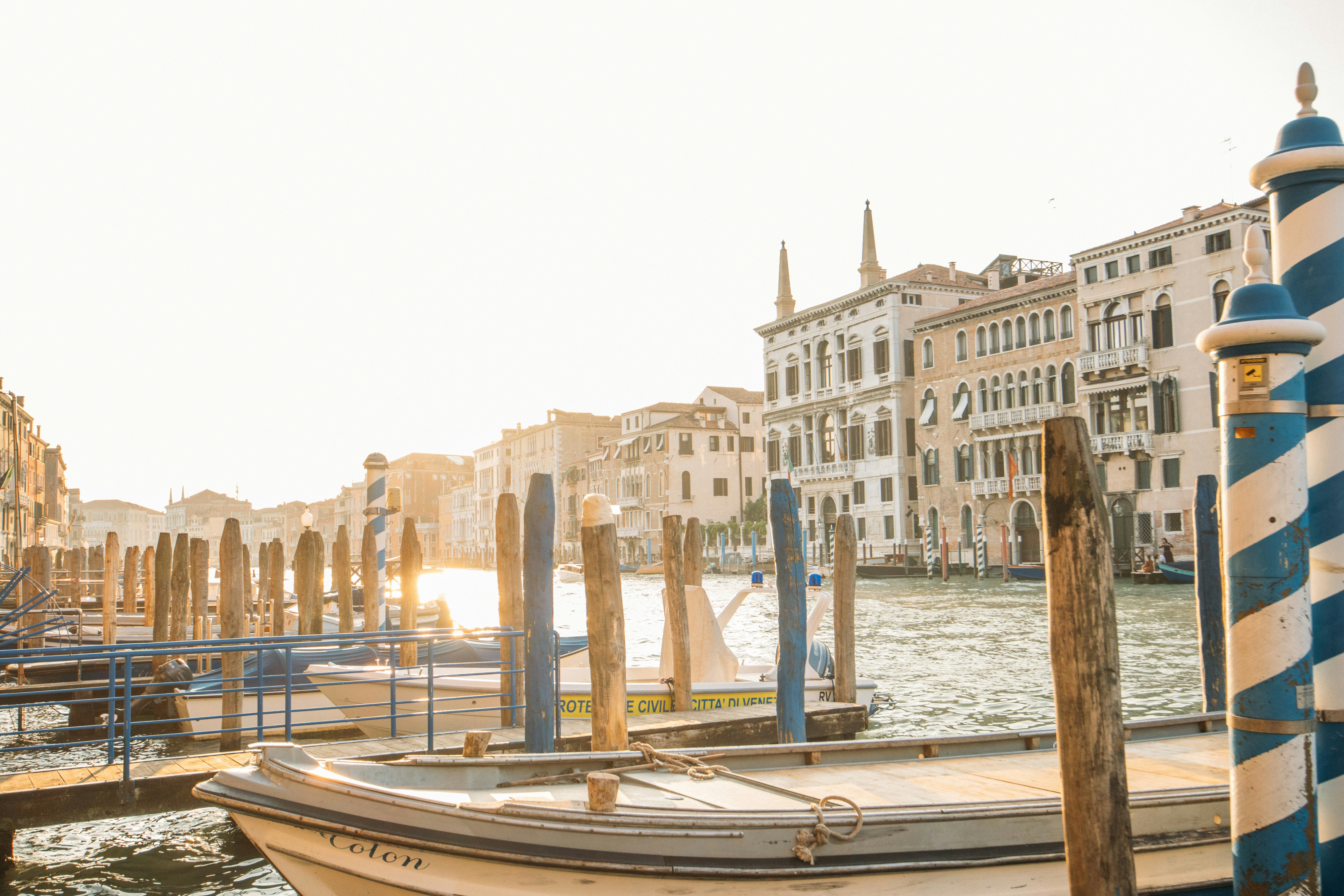Boats Docked In A Sunny Venetian Canal With Historic Buildings. HD mobile wallpaper