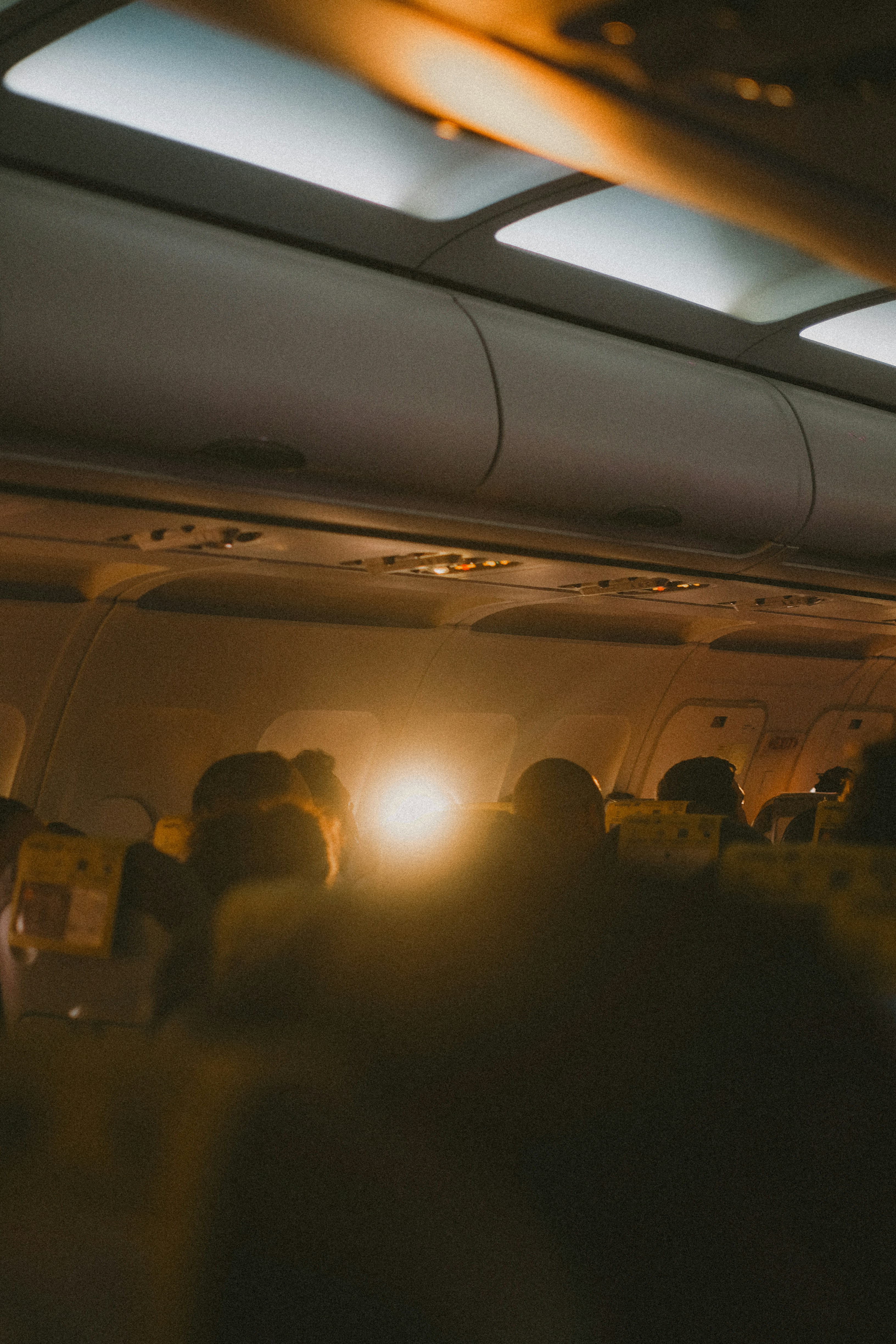 Airplane Cabin With Passengers Silhouetted By Bright Light HD mobile wallpaper