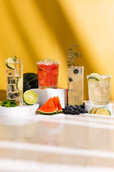 Variety Of Refreshing Cocktails With Fruit Garnishes wallpaper preview