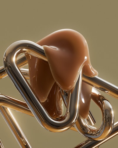 Shiny Gold Abstract Shapes With A Brown Caramel-like Substance. wallpaper preview