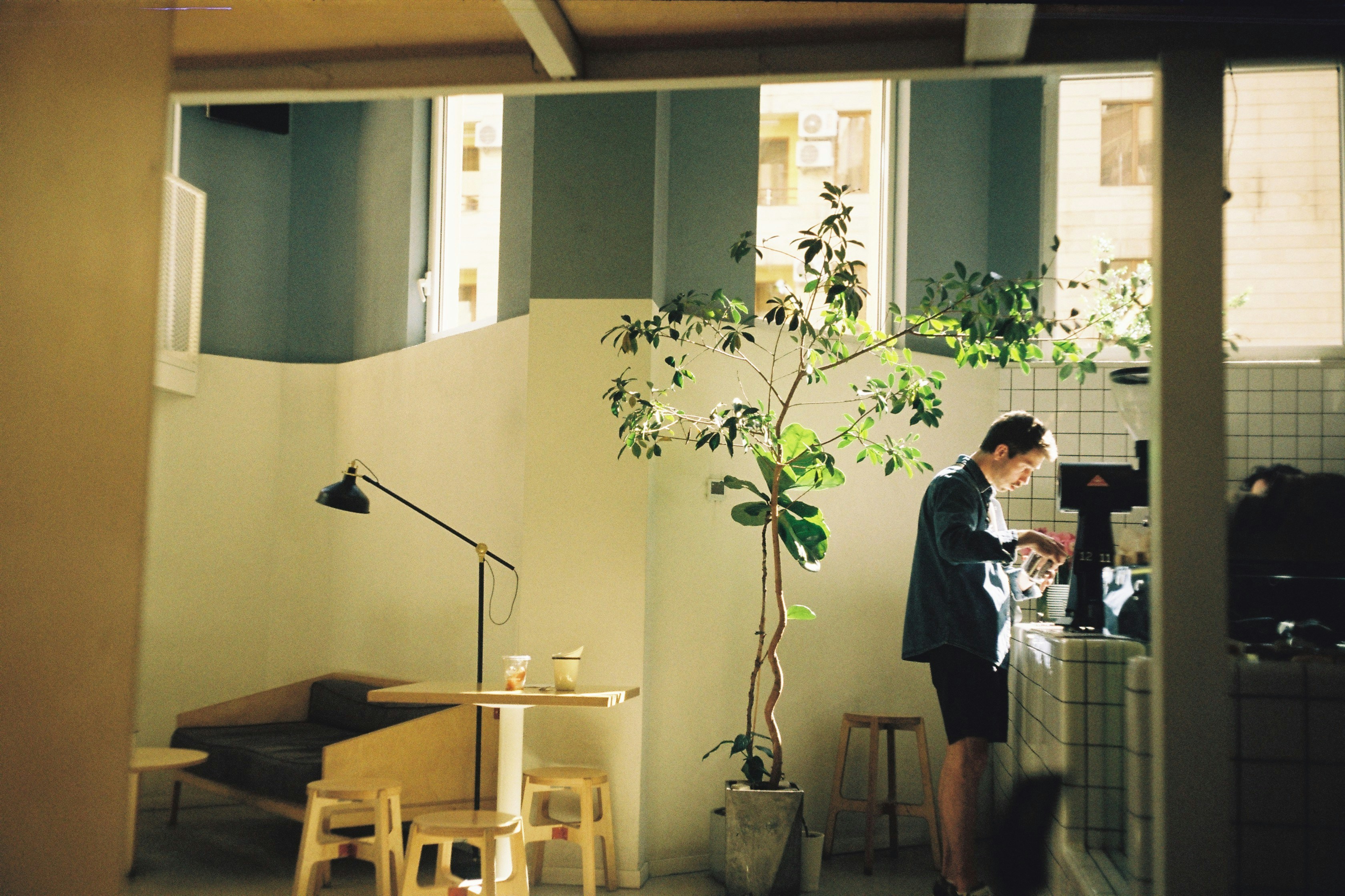 Woman Preparing Drinks In A Bright, Modern Cafe. HD mobile wallpaper