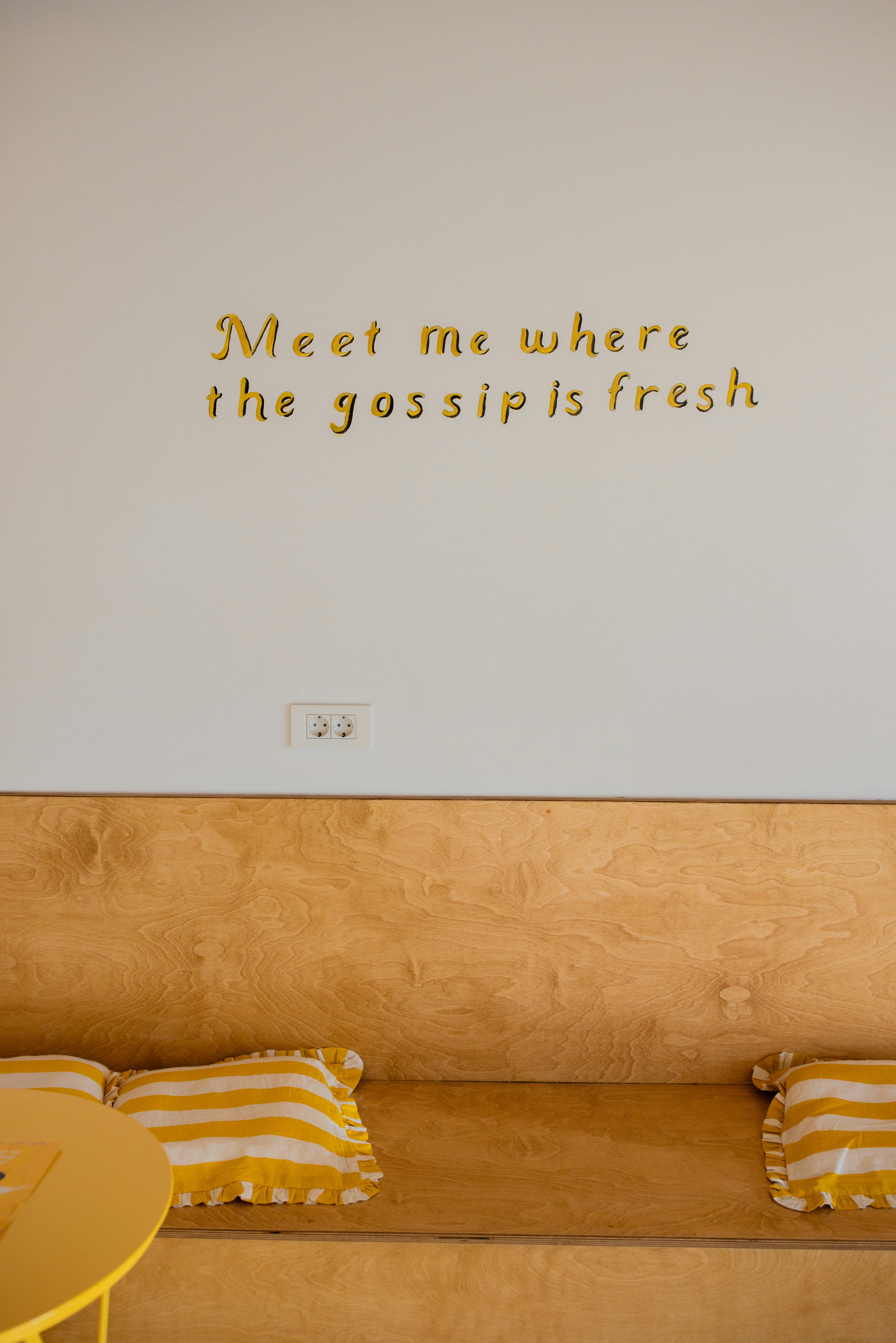 Gold Lettering On White Wall Above Wooden Bench HD mobile wallpaper