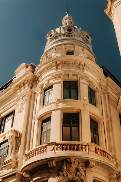 Ornate Building With Dome And Balcony Under Blue Sky wallpaper preview