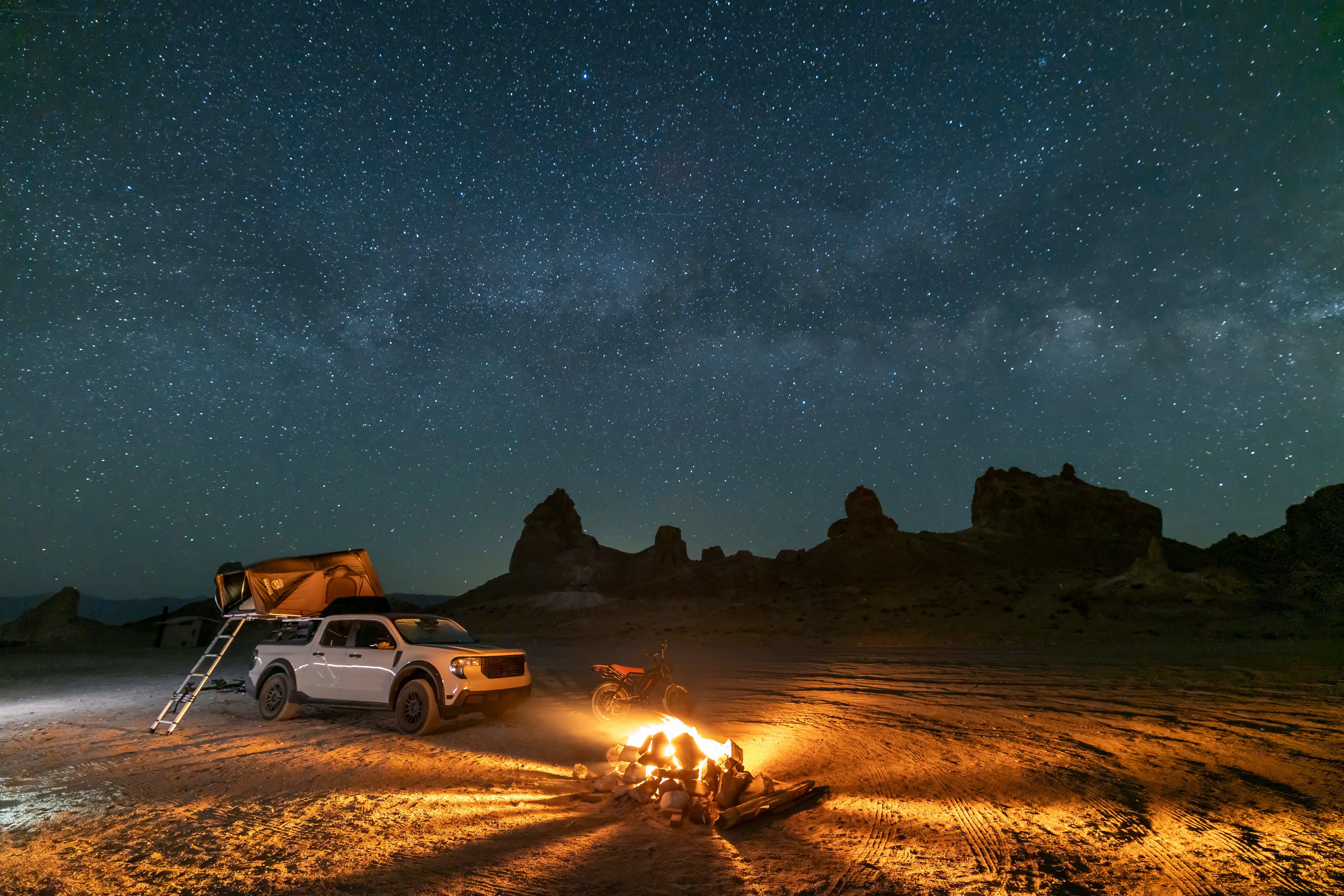 Campfire And Truck Under A Starry Desert Night Sky. HD mobile wallpaper
