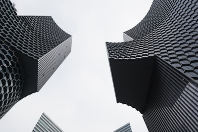 Modern Buildings With Honeycomb Facade Against Sky wallpaper preview