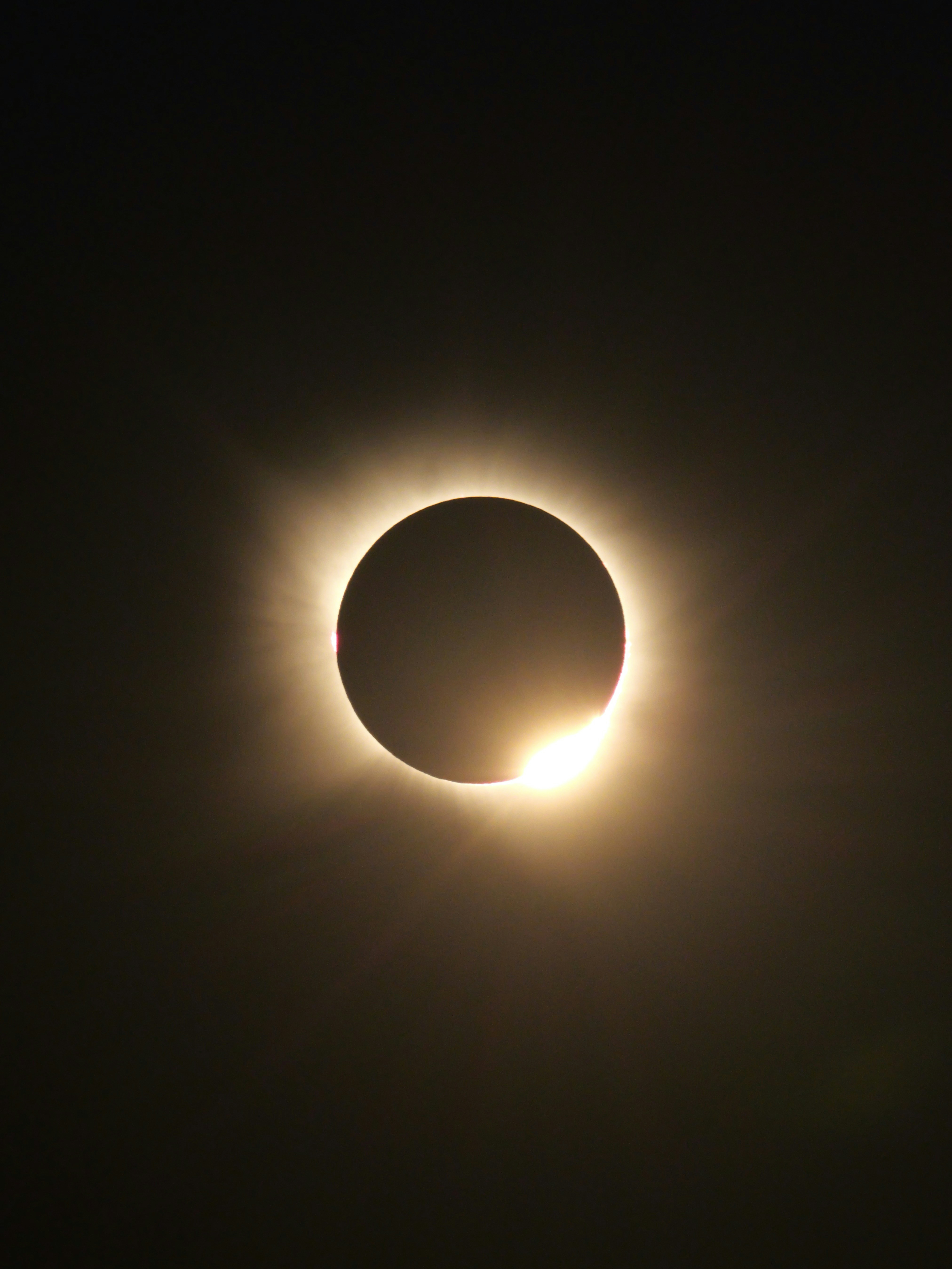 A Total Solar Eclipse With A Bright Diamond Ring Effect In The Dark Sky. HD mobile wallpaper