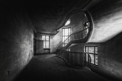 A Person In A White Dress On A Curved Staircase In A Derelict Building wallpaper preview