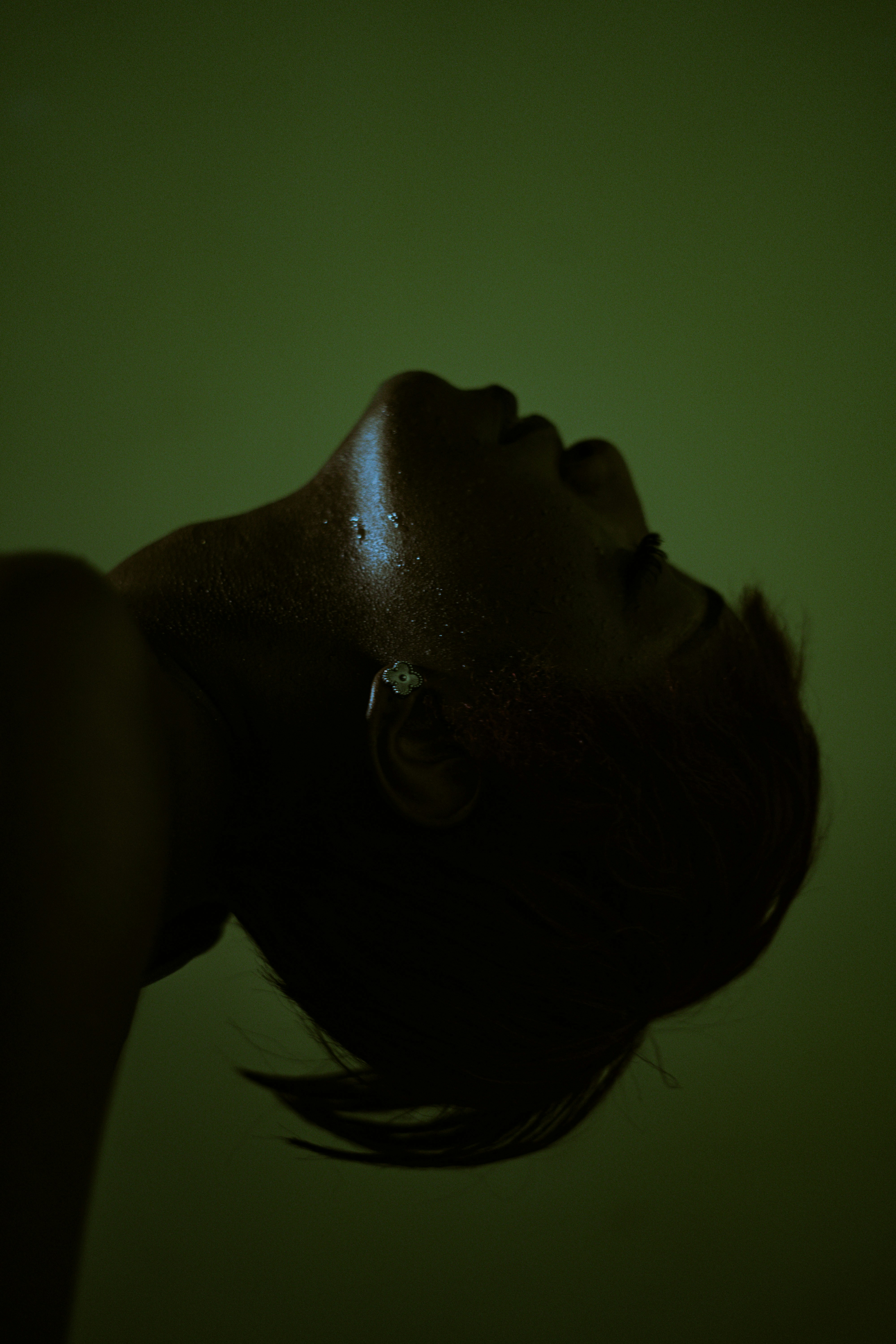 Dramatic Silhouette Of A Person With Wet Skin On Green HD mobile wallpaper