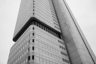 A Low-angle View Of A Modern Skyscraper With A Grid Of Windows wallpaper preview