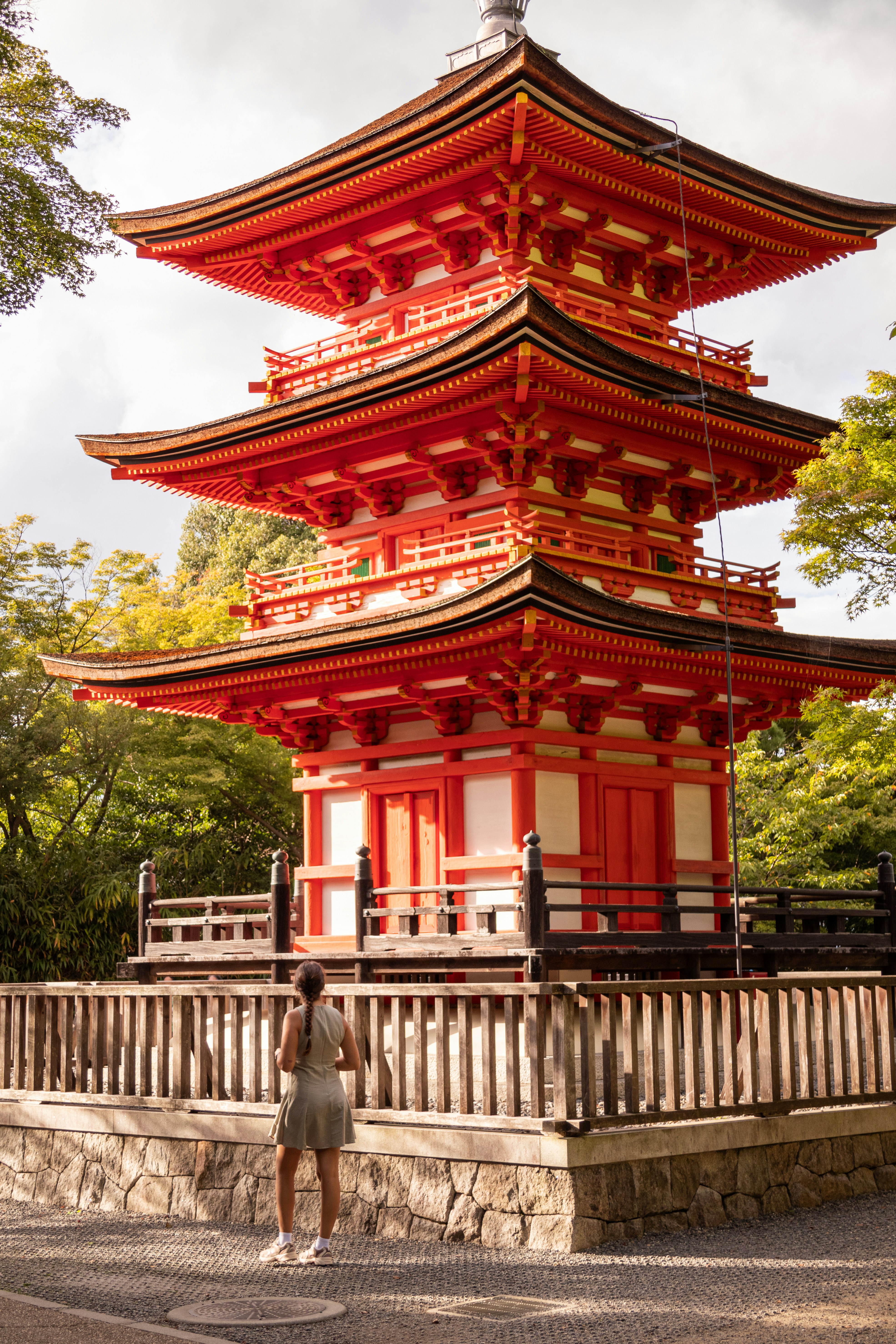 A Girl Standing In Front Of The Koyasu Pagoda In Kyoto, Japan. The Name “Koyasu” Means “easy Childbirth,” And Legend Says That Praying There Ensures A Safe Delivery For Expectant Mothers. HD mobile wallpaper