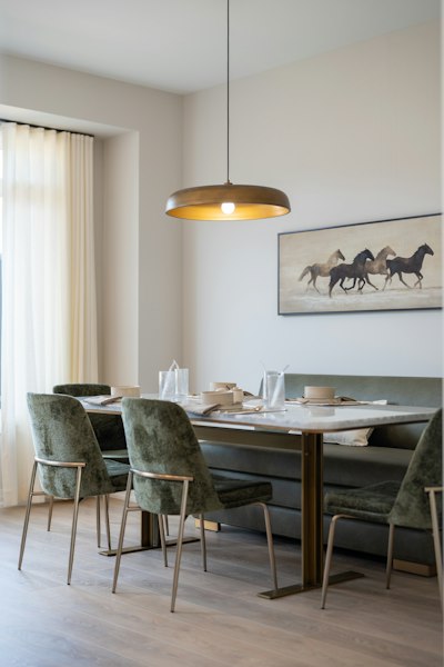 A Dining Table With Green Velvet Chairs And A Bench In A Sunlit Room wallpaper preview
